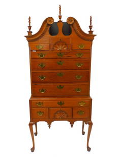 Connecticut Highboy. Second half 18th-century.: Primary wood is cherry with pine secondary. Made in Coastal Connecticut, possibly New London. Full bonnet with flame urn finials. Carved rosettes. Dental molded trim. Two shell carved drawers. Reeded