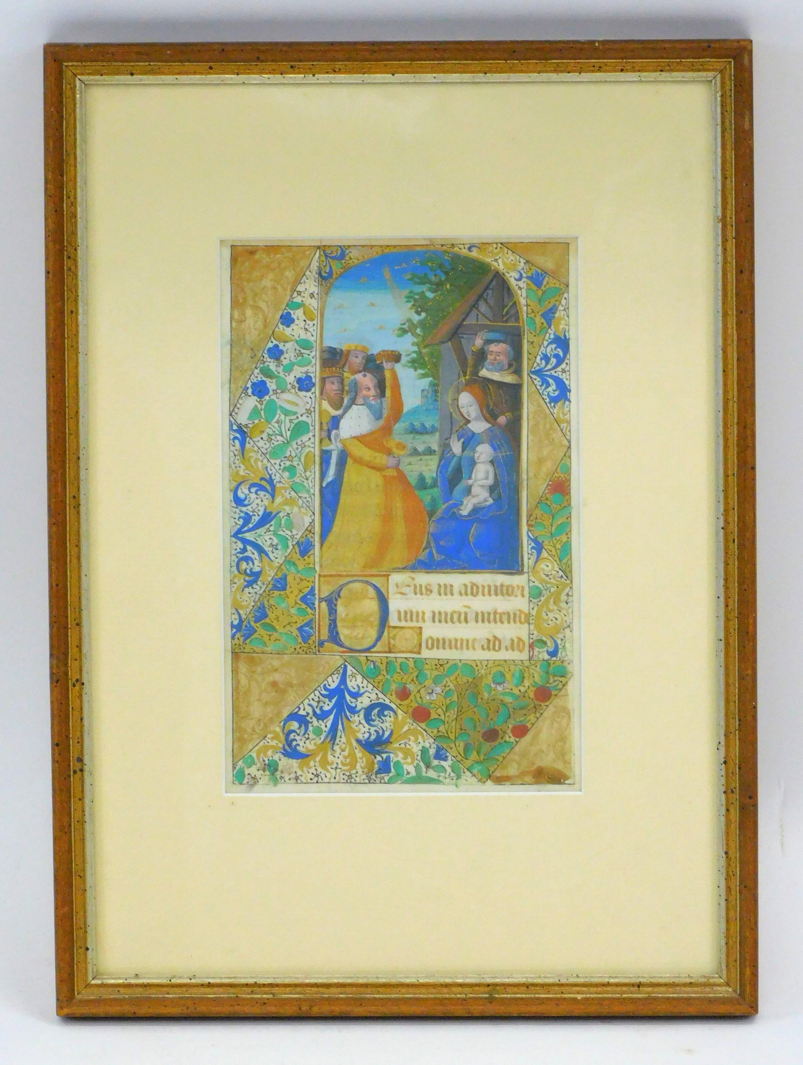 Medieval illuminated manuscript. Vellum page.: Depicting the three kings paying homage to the baby Jesus. Written in Latin. The image contains elaborate marginalia. Sight size 5" by 4 1/2". Overall size 12" by 9 1/2".