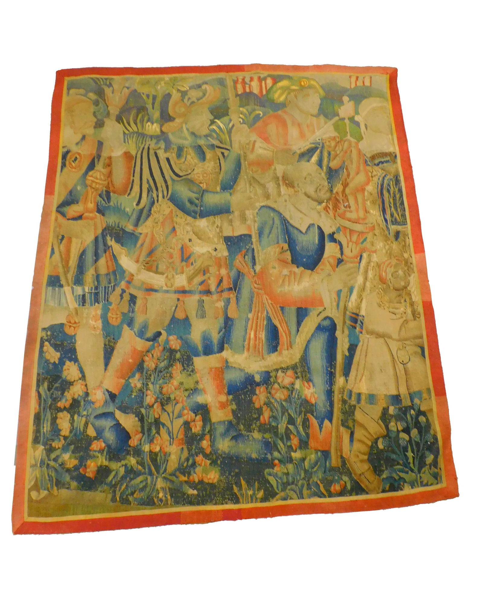 Flemish tapestry. 16th/17th-century. Partial: panel. Red, blue and beige color. Depicting multiple figures and flowers. 78" high by 63" wide. Age-appropriate wear. Some separating.