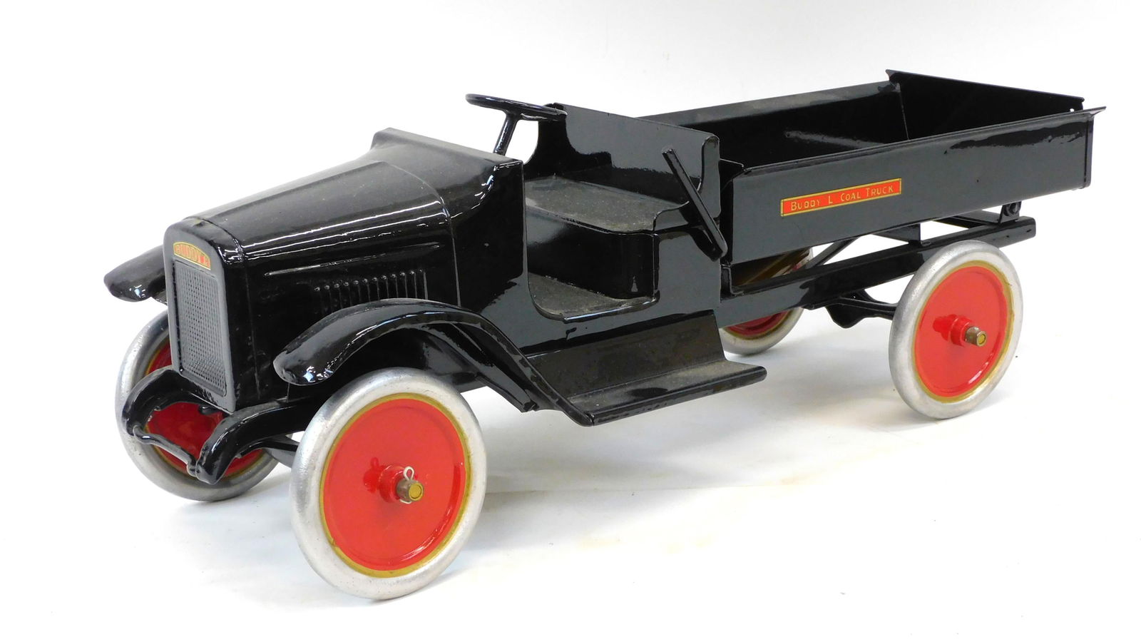 Buddy L Pressed Steel Coal Dump Truck. Restored: condition. 8 1/2" high by 24" long by 8 1/2" wide. Shows dents to fenders.