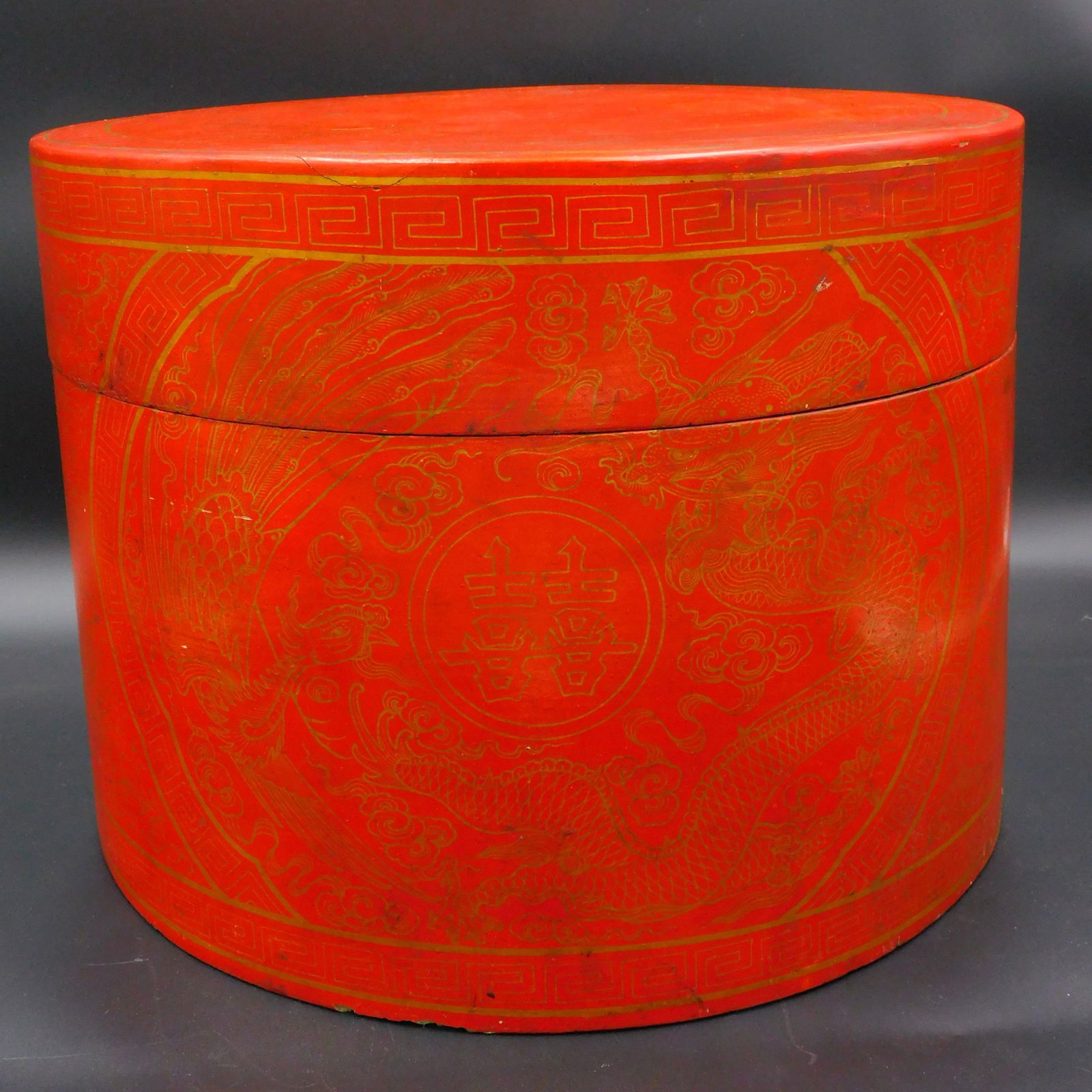 Red and gold Mandarin hat box. 19th-century. A: lacquer hat box. Probably a gift from the Chinese Emperor, as it as the five-toed dragon which was reserved for the Imperial family, other nobility having to content themselves with a dragon of four t