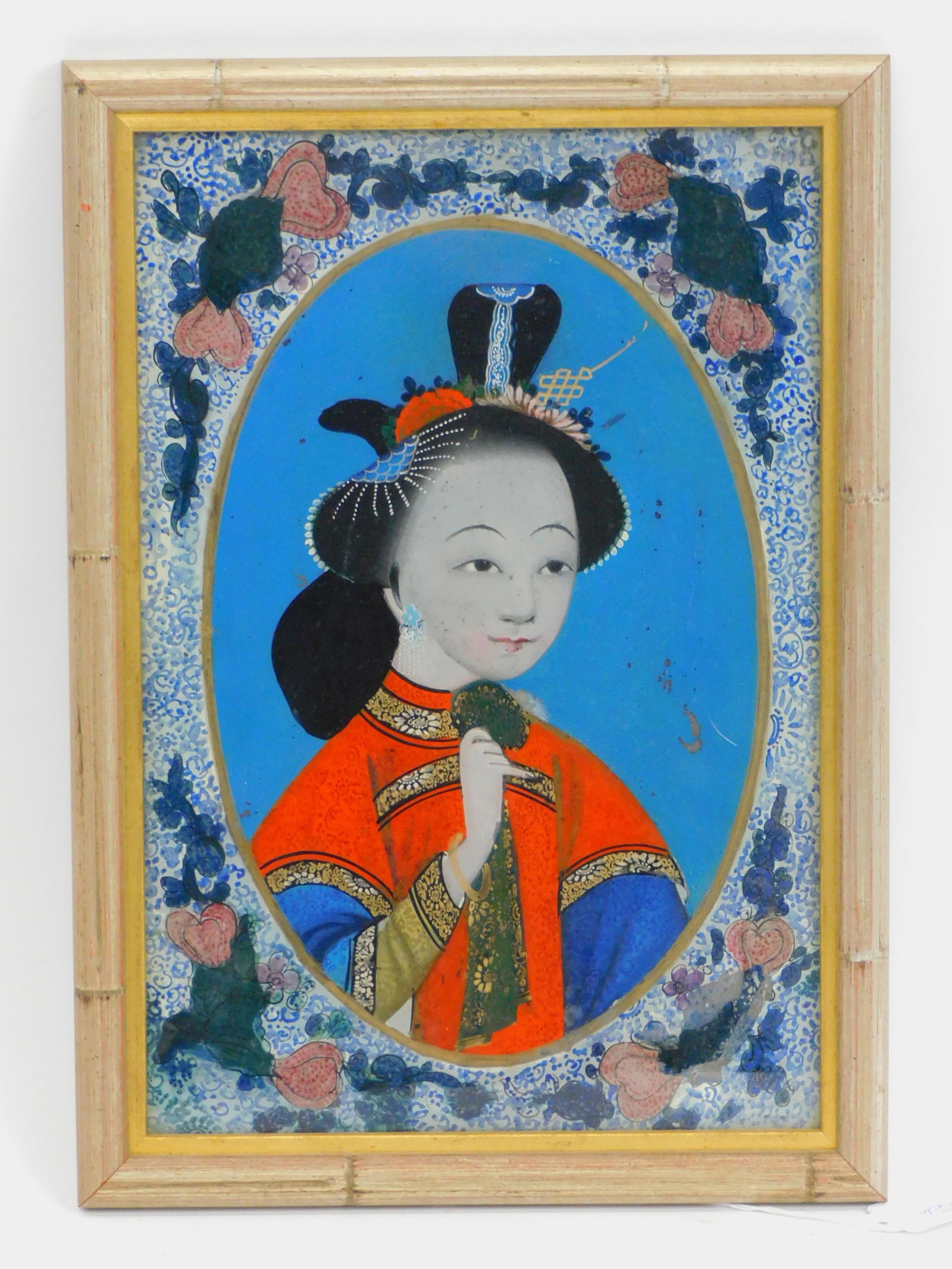 Chinese Reverse Painted Portrait. 19th century.: Portrait of a young woman in a later faux bamboo frame. 14 3/4" by 10 1/2". Good condition.