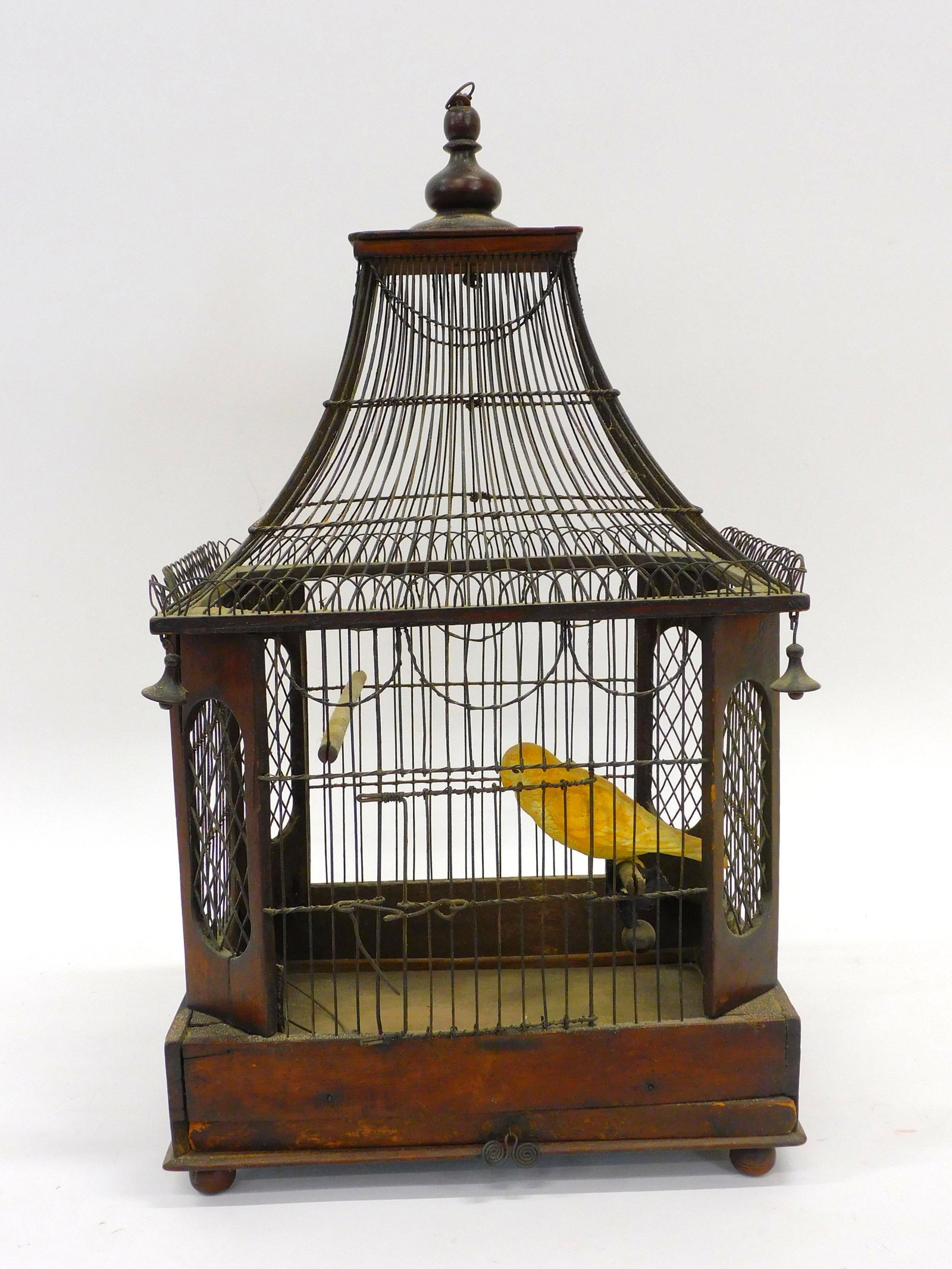 Victorian birdcage. Fancy wirework on wood.: Pagoda form. Old finish. 21" high by 12" wide by 9 1/2" deep.