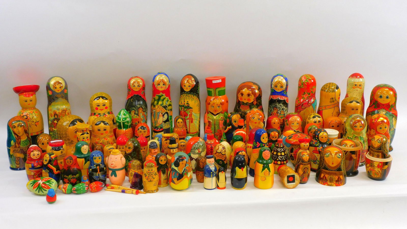 Large collection of modern hand painted Russian: and Chinese nesting dolls, approx. 400 individual pieces or more, ranging in size from 15" high to 3 1/2" high. Each piece is painted as an individual figure. Some of the subjects include a penguin, S