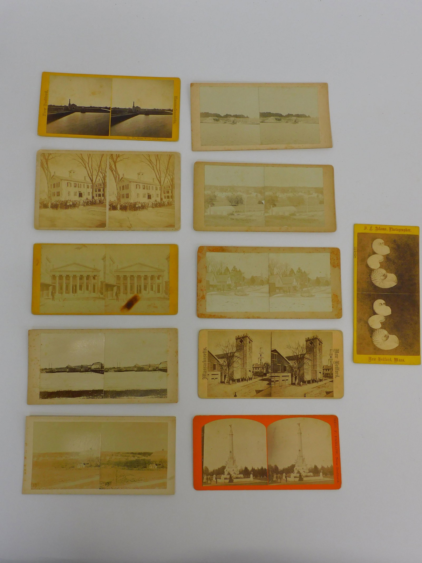 (5) Westport stereo view cards. To include:: station, at the head of Westport, Village view, Westport point, Westport River. (6) New Bedford cards include Bush Street school, Merchants Bank building, waterworks, Congregational church. 3 1/2" by 