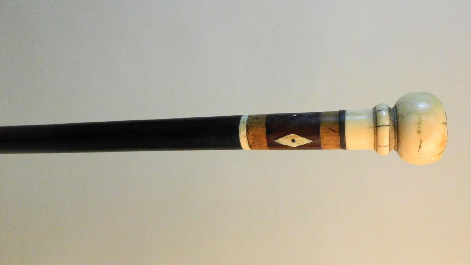 Scrimshaw walking stick. 19th century. Made of: whalebone, lignum vitae, rosewood shaft, 36" long, excellent condition.