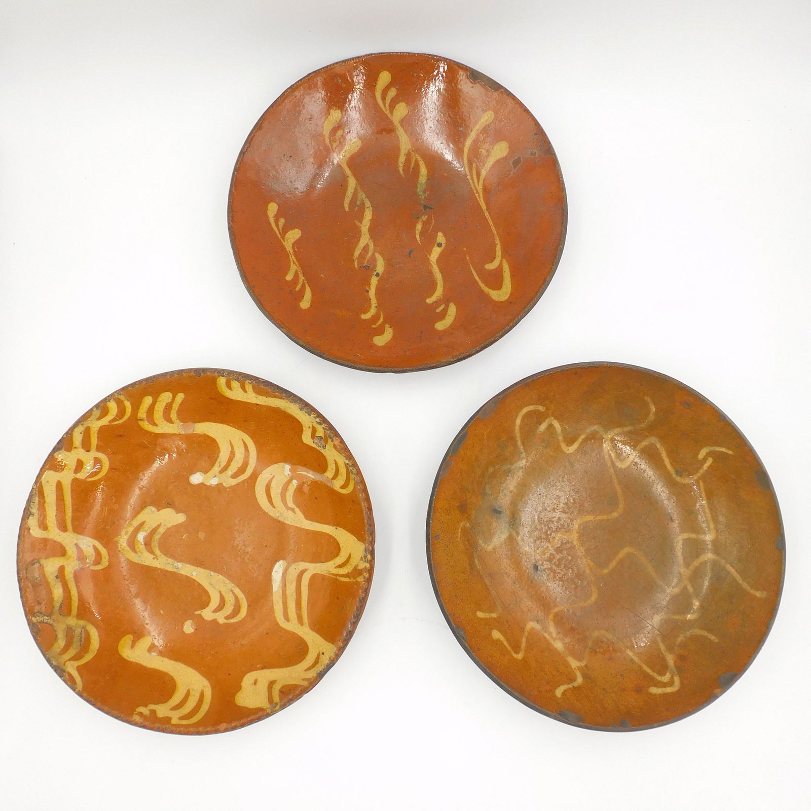 (3) redware yellow slip glazed bowls. (1 of 5)