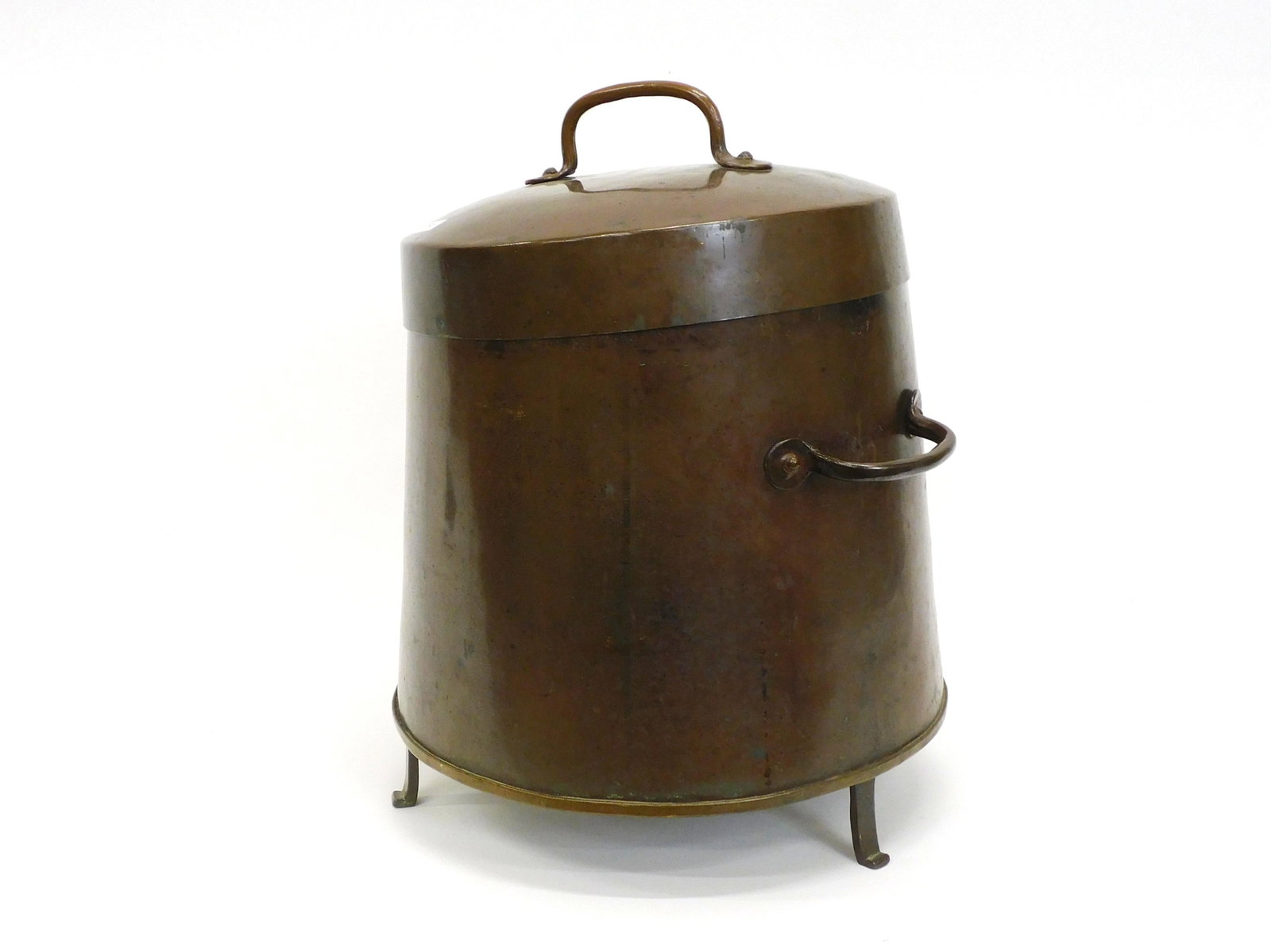 A copper doofpot or coal canister bucket. 18th: century. Dovetail construction. Hand wrought handles and feet. 17" high, 13" diameter.