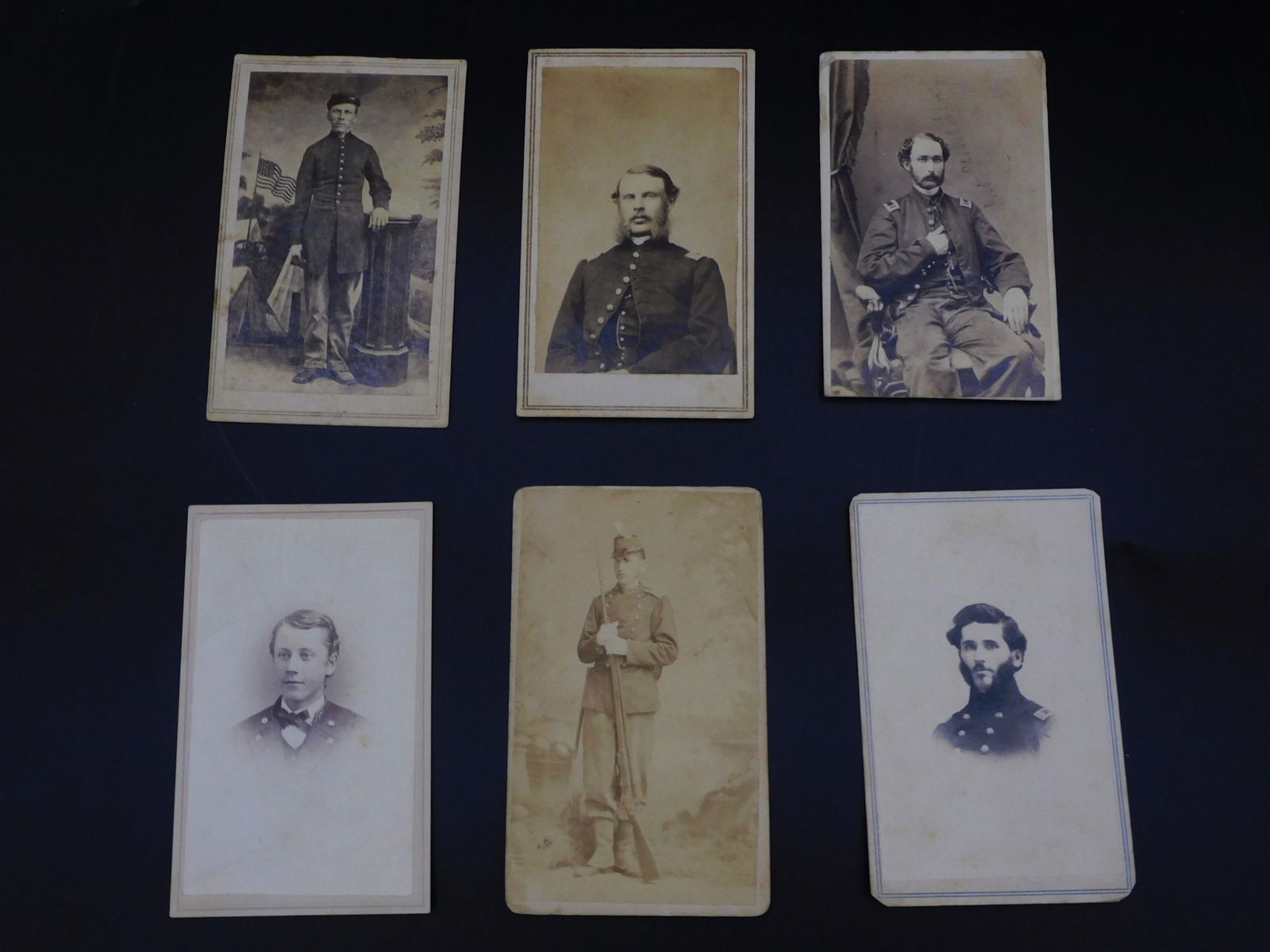 (6) Civil War CDV's, 4" x 2 1/2". To include: 1): Isaac Osar Simpson of Mattapoisett, MA. He was born February 6, 1845, and died April 3, 1865. He served in the US Navy in the Civil War. Light foxing. 2) Lieutenant Spaulding, taken by J. Black, Washi