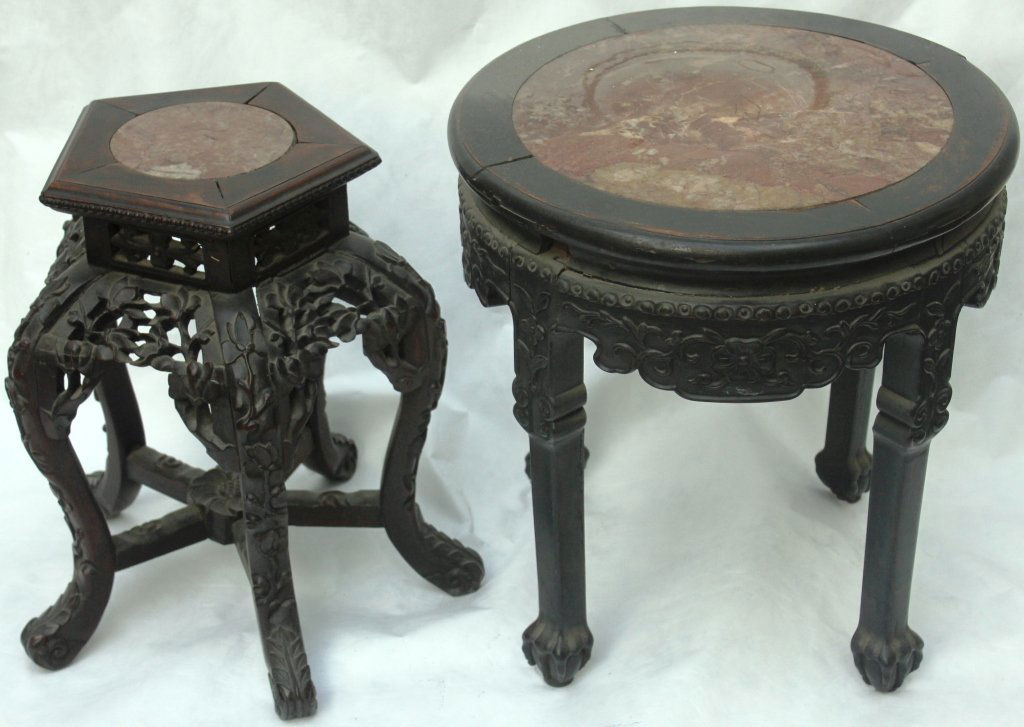 PAIR OF LATE 19TH CENTURY CARVED TEAK STANDS: WITH INSET MARBLE TOPS, ONE WITH MINOR DAMAGE, 1 STAND 19" HIGH, 18" DIAMETER, OTHER STAND 18" HIGH, 13" TOP