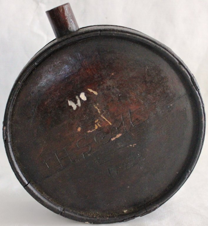 RARE CONFEDERATE ARMY COMBAT WOODEN CANTEEN: WITH THE NAME OF THE OWNER J. H. SCOTT, LA LOUISIANA), 1862, CAVED IN THE SIDE, 7 1/4" DIAMETER, 2 1/2" DEEP