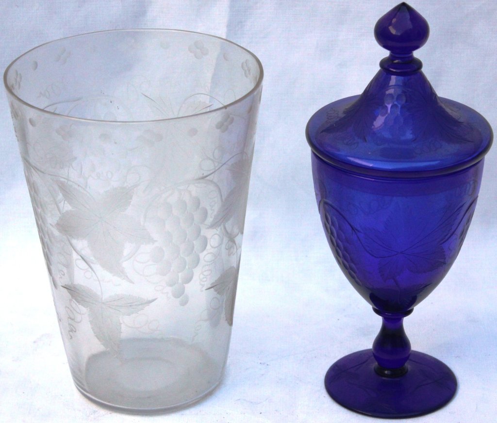 2 PCS OF ENGRAVED PAIRPOINT GLASS CONSISTING: OF COBALT COVERED JAR, 10" HIGH AND A CLEAR 8" HIGH FLIP GLASS