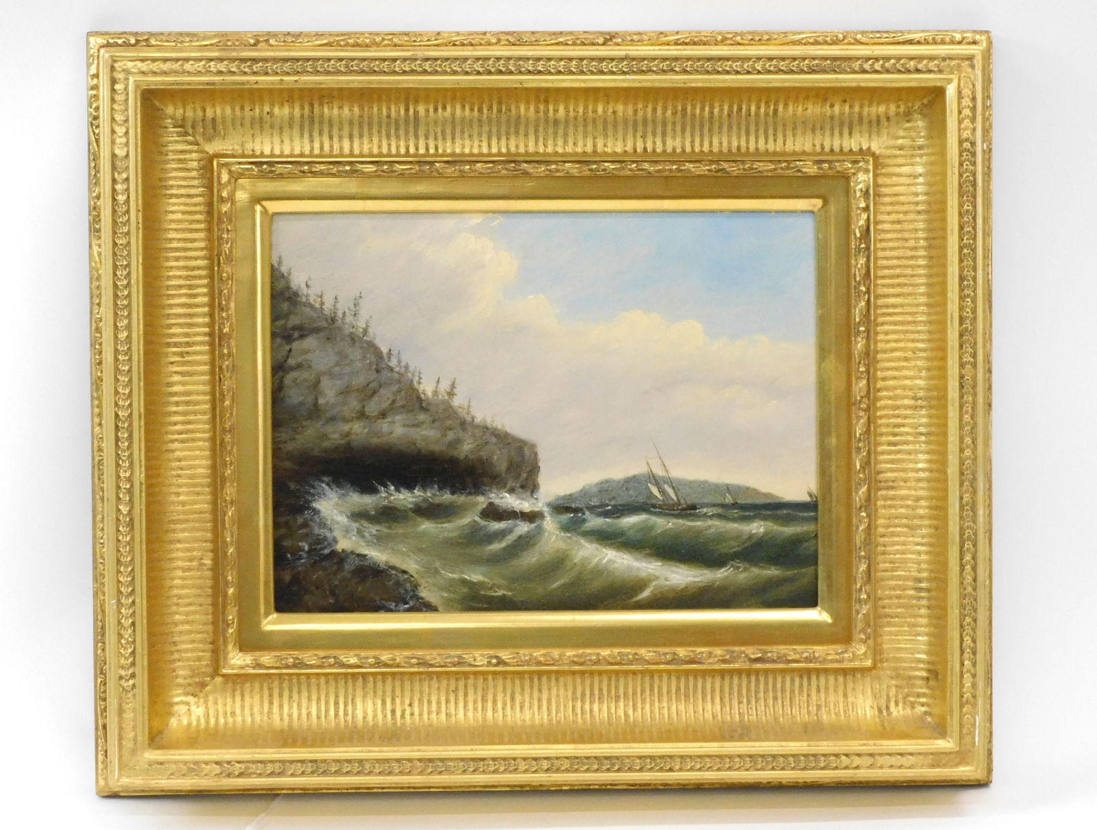 Clement Drew (1806-1899): Oil painting on panel. Titled "Mount Desert Island Schooner Hay". Signed on verso and dated 1883. Sight size 9" x 12". In a high quality modern carved and gilded frame 16" x 19". UV light reveals some