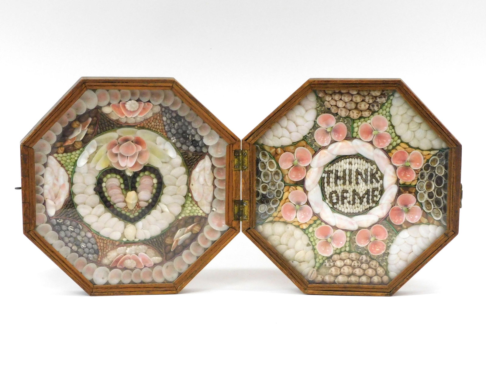 Sailor's Valentine: 19th c. West Indian shellwork double sailor's valentine. Right side reads THINK OF ME; Left side features heart motif. Original octagonal walnut box. Each side 8 1/2" x 8 1/2". Overall good condition.