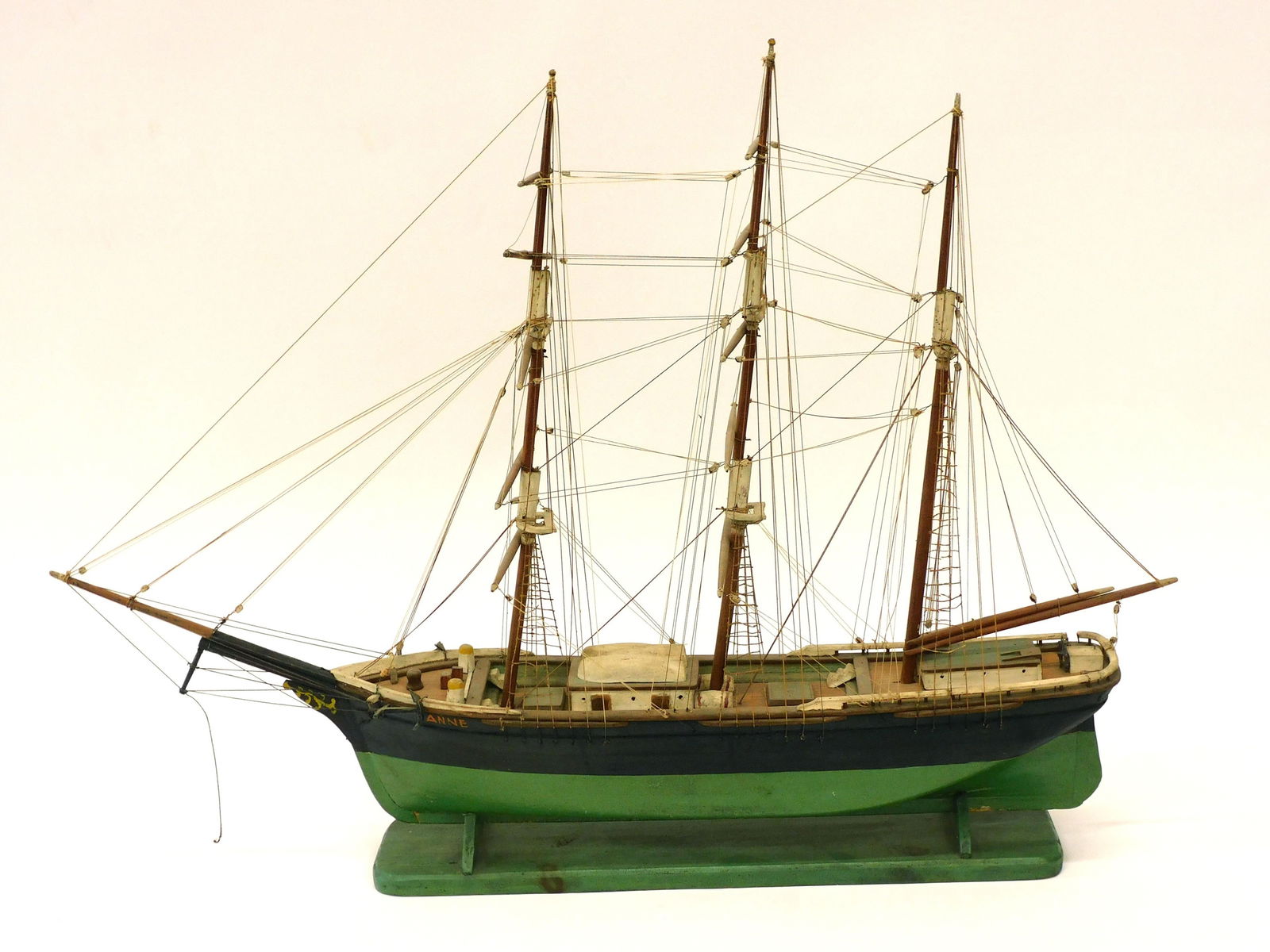 Anne Three Masted Wooden Ship Model: Early 20th c. fully rigged with cradle, original paint and natural finish. 22 1/4" H x 30" L x 8" D.