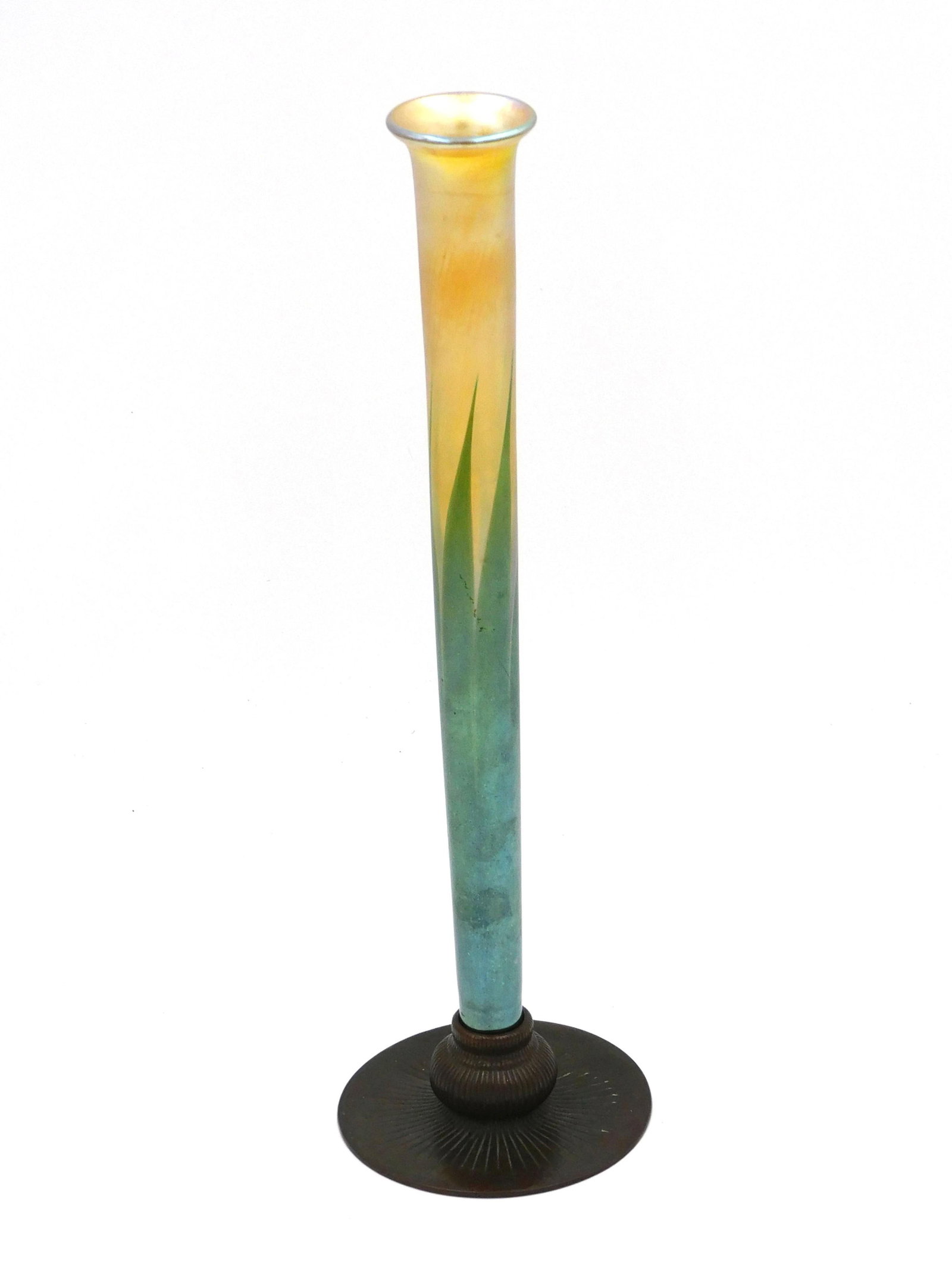 Tiffany Art Glass Bud Vase: Bronze base marked Tiffany Studios, New York, No. 710. Glass iridescent vase marked LCT. Overall height 12 1/2" and the diameter of the base is 3 3/4".
