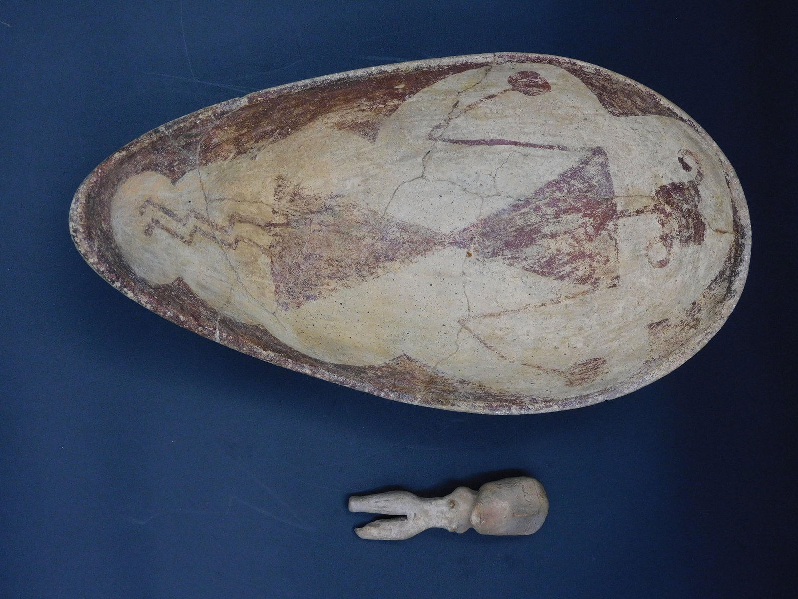 2 Pieces Of Hohokam Pottery: to include Pre-Columbian 3 3/4" effigy figure, some loss to one foot. Along with scoop with human type figure, restored condition, 4 1/2" high, 11 1/2" long, 6 5/8" wide.