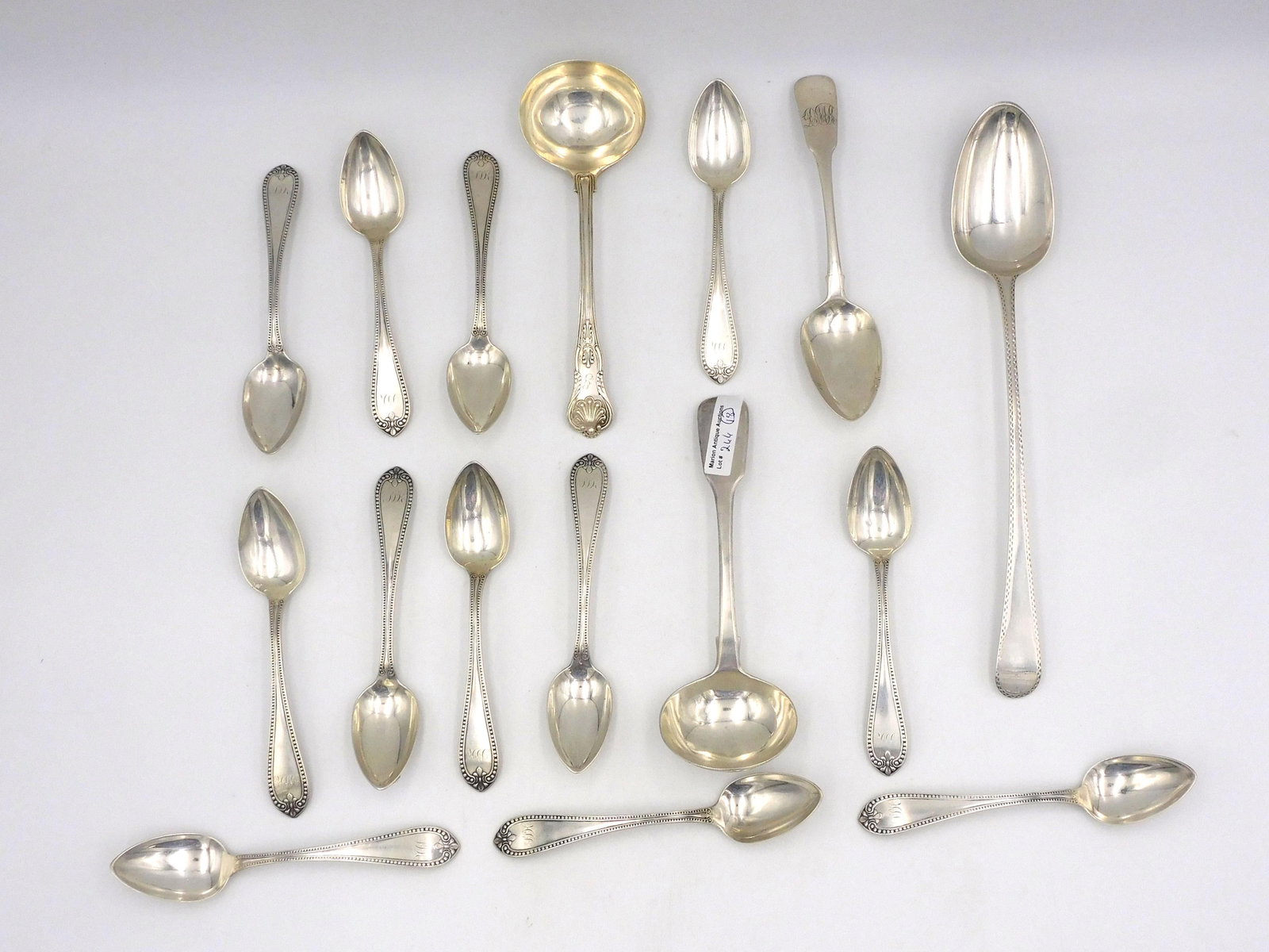 A Collection Of (16) Pieces Of English Silver: To include: (1) 18th c. serving spoon, George Smith, London 1873, 11 1/4" long. (1) 7 1/4" monogrammed spoon, 1814, Sarah & John William Blake. (1) King's Pattern ladle, 7 1/4" long. (1) 7 1/4" monogr