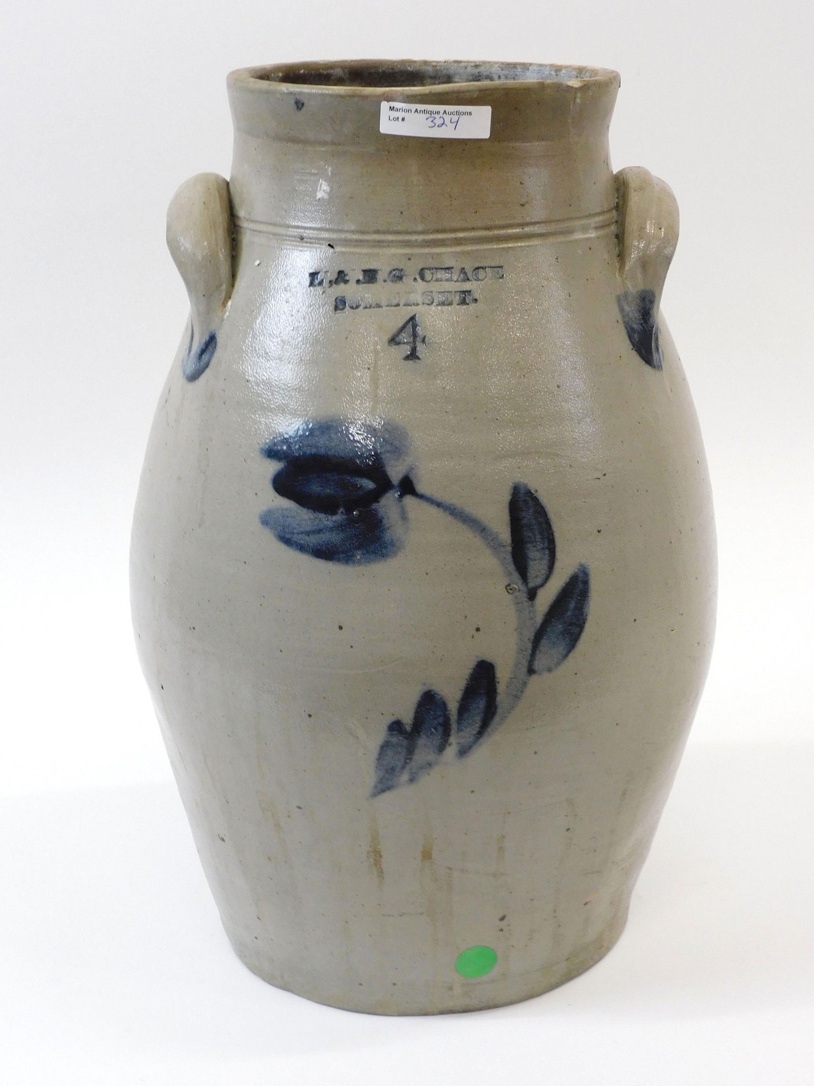Four Gallon Ovoid Stoneware Churn: L&B.G. Chace Somerset with blue floral decorations. Old chips to rim. Blue splash applied handles. 16 1/2" high x 10 1/2" diameter.
