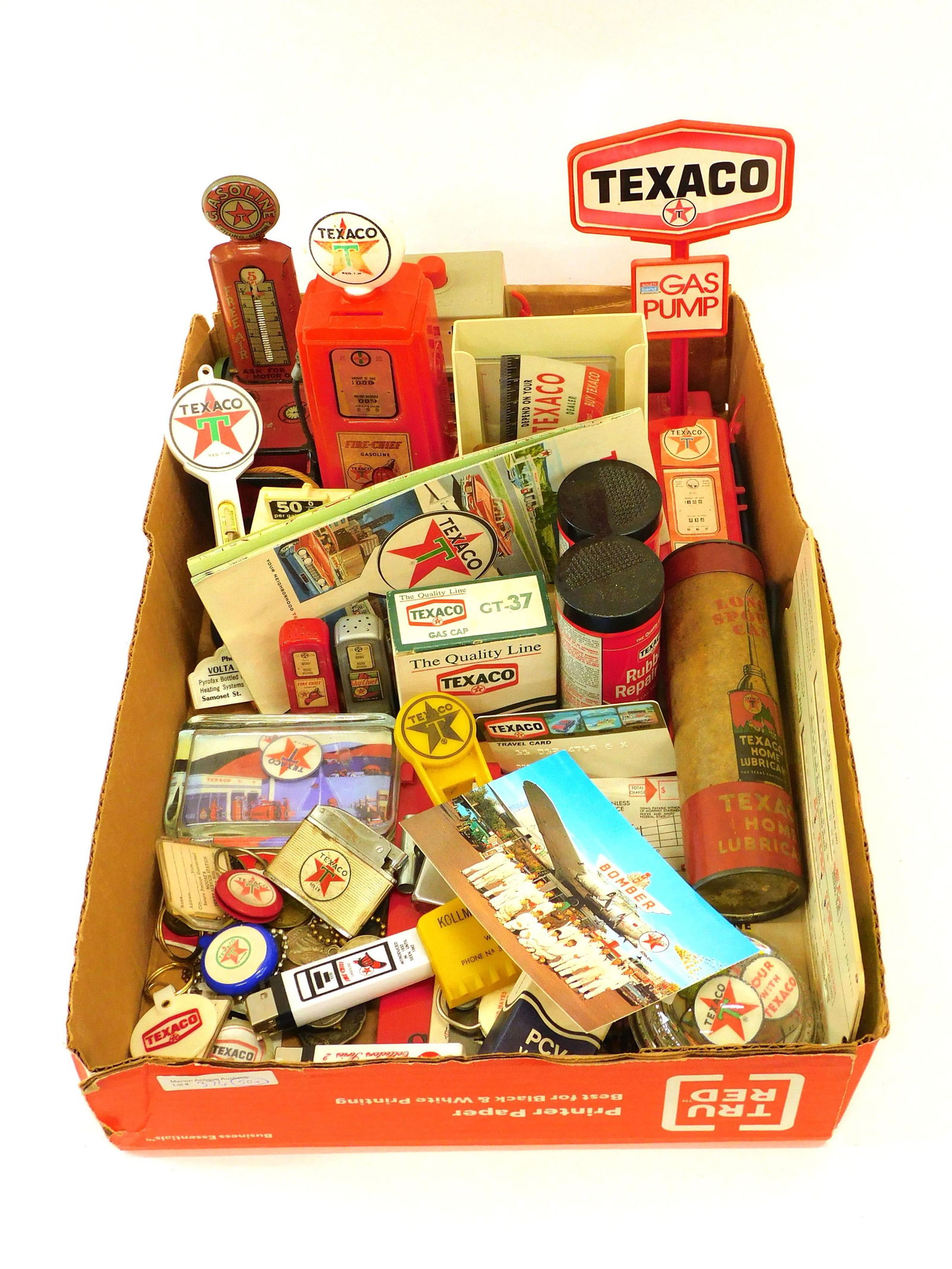 (50+) Collection Of Texaco Novelty Items: 20th c. advertising premiums, toys, and ephemera including keychains, cigarette lighters, repair kits, tokens, etc. Early litho tin motor oil pump, 8" high. Most items show age appropriate wear. No ma
