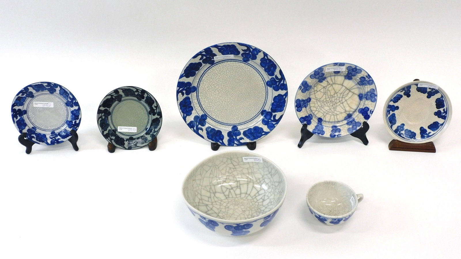 (7) Pieces Of Dedham Pottery: Grape pattern. To include: 8" diameter bowl out of round x 4" deep with faded blue mark. Shows some spider cracking and large crazing. 10" plate with blue mark. 7 3/8" diameter plate with double stamp