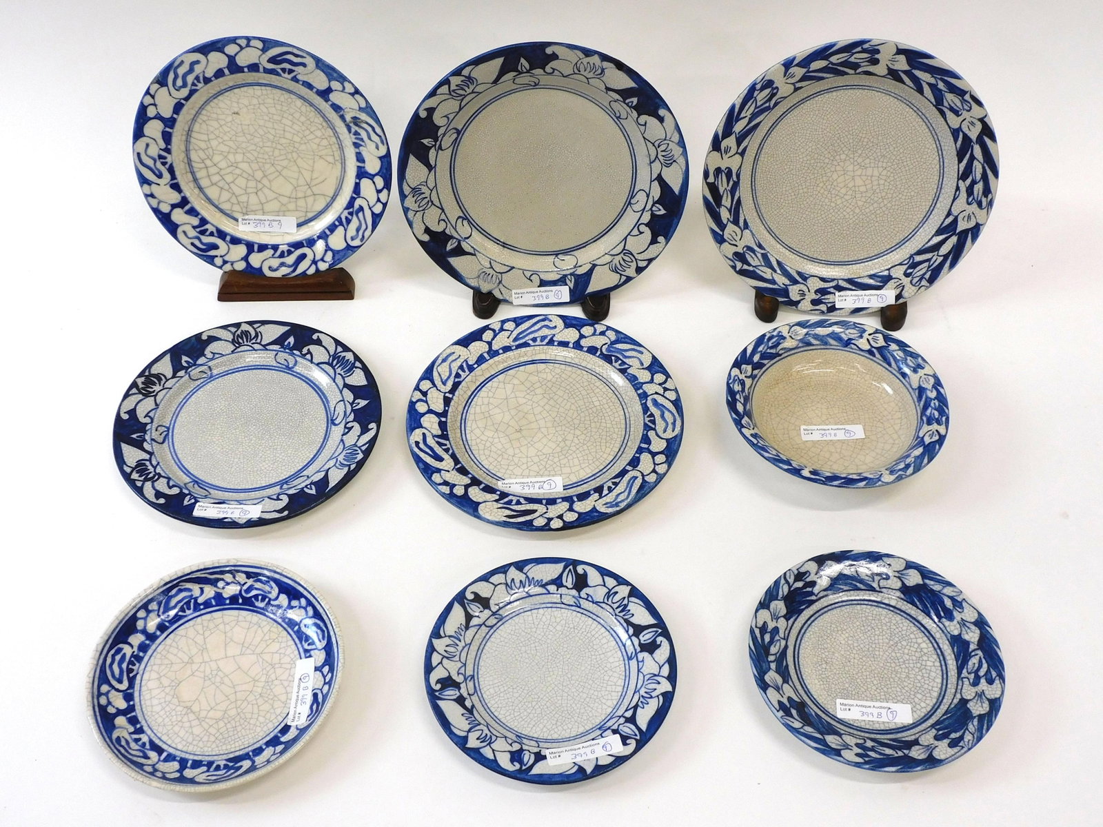 (9) Pieces Of Dedham Pottery: Azalea, Snow Tree and Magnolia patterns. Plate: 8 1/2" Magnolia double impressed rabbit and blue mark. Minor glaze loss to rim. Plate: 7 3/8" Magnolia double impressed rabbit and blue mark. Plate: 6" 