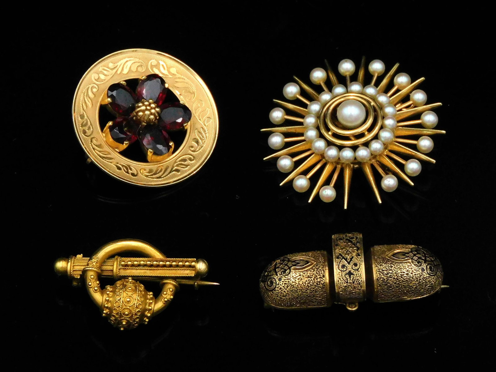 (4) 14K Gold Brooch Pins: (2) marked 14K, 1 starburst with pearls, one gold spoke missing and one pearl missing. The other, a round pin with garnets. (2) Victorian pins tested. 18.9 dwt. PLEASE NOTE: this lot must be paid for 