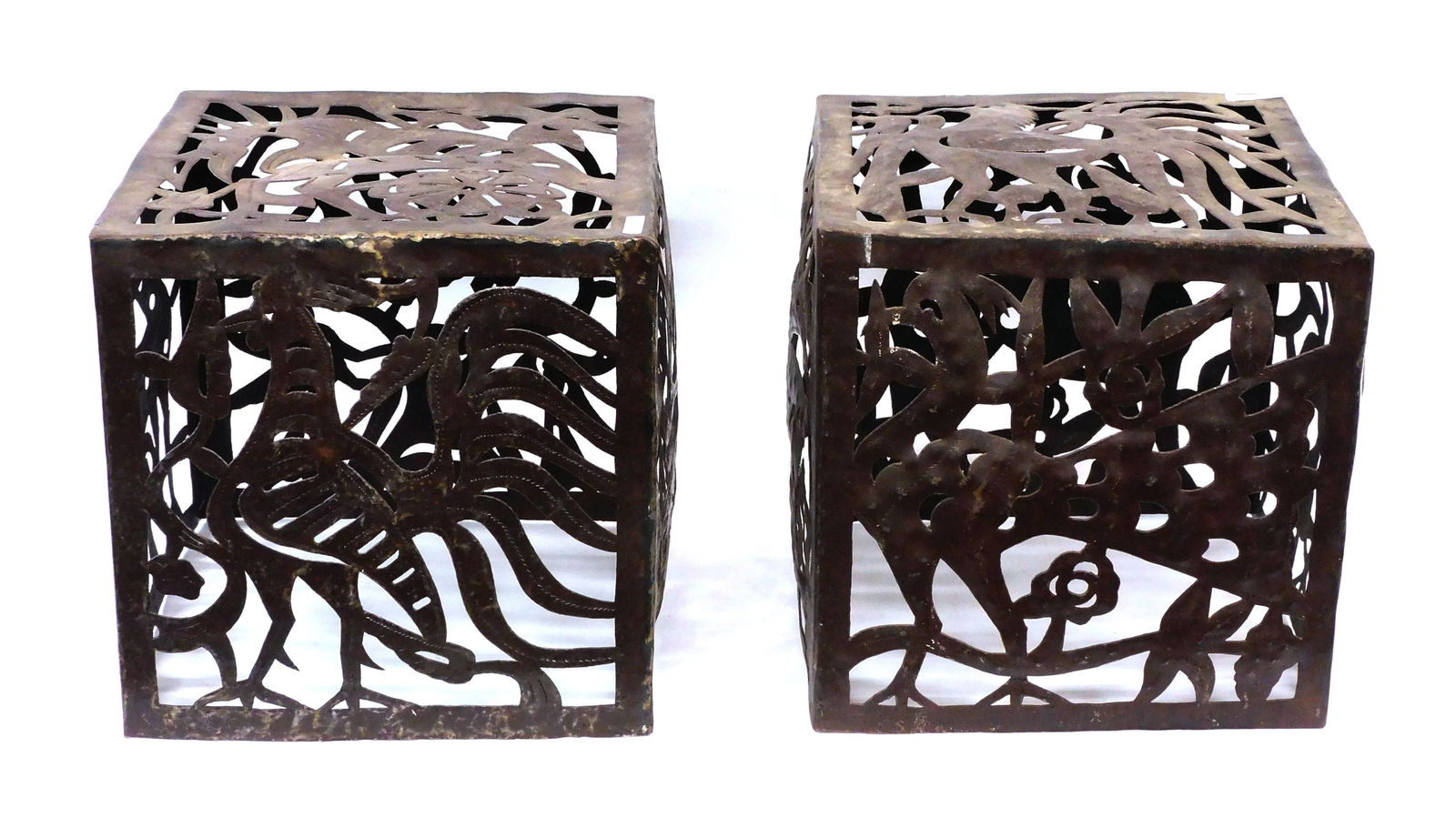 Jean Pierre Bernard For Harvey Probber: Ca. 1960s - 70s. (2) Torch-cut welded and chased steel cubes. Made in Croix-des-Bouquets, Haiti of recycled steel drums. Typical of Haitian folk art, these cubes feature lions, birds, foliage, horses
