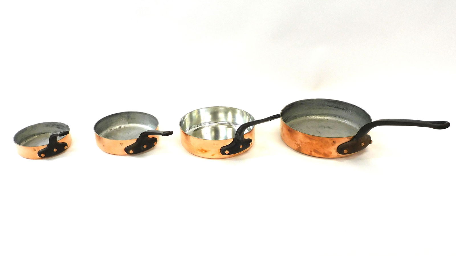 (4) Vintage French Copper Graduated Sauté Set: All sauté pans are stamped The Design Store France. The smallest is 1 3/4" high x 6 1/2" diameter and weighs 2.93 lbs. The next is 2 1/4" high x 8" diameter and weighs 4.53 lbs. The second largest is