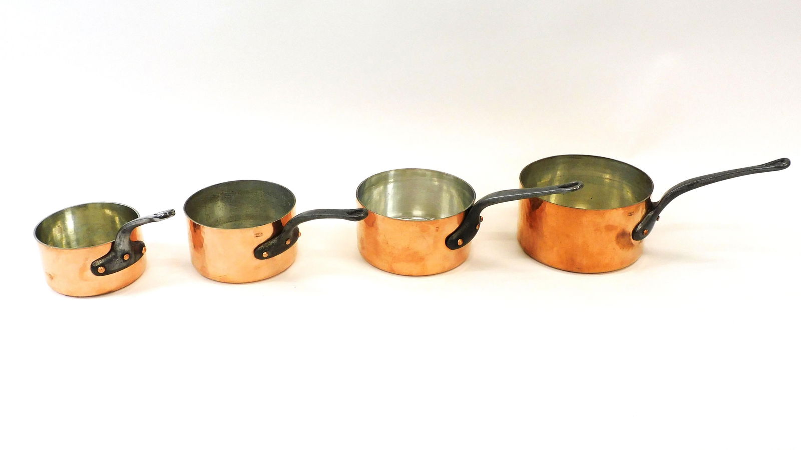 (4) Vintage Hammered French Copper Sauce Pans: The smallest pan stamped Matfer toque (chef's hat) measures 3 1/4" high x 5 5/8" diameter and weighs 3.20 lbs.. The next stamped Made in France measures 3 3/4" x 6 1/2" diameter and weighs 3.90 lbs..