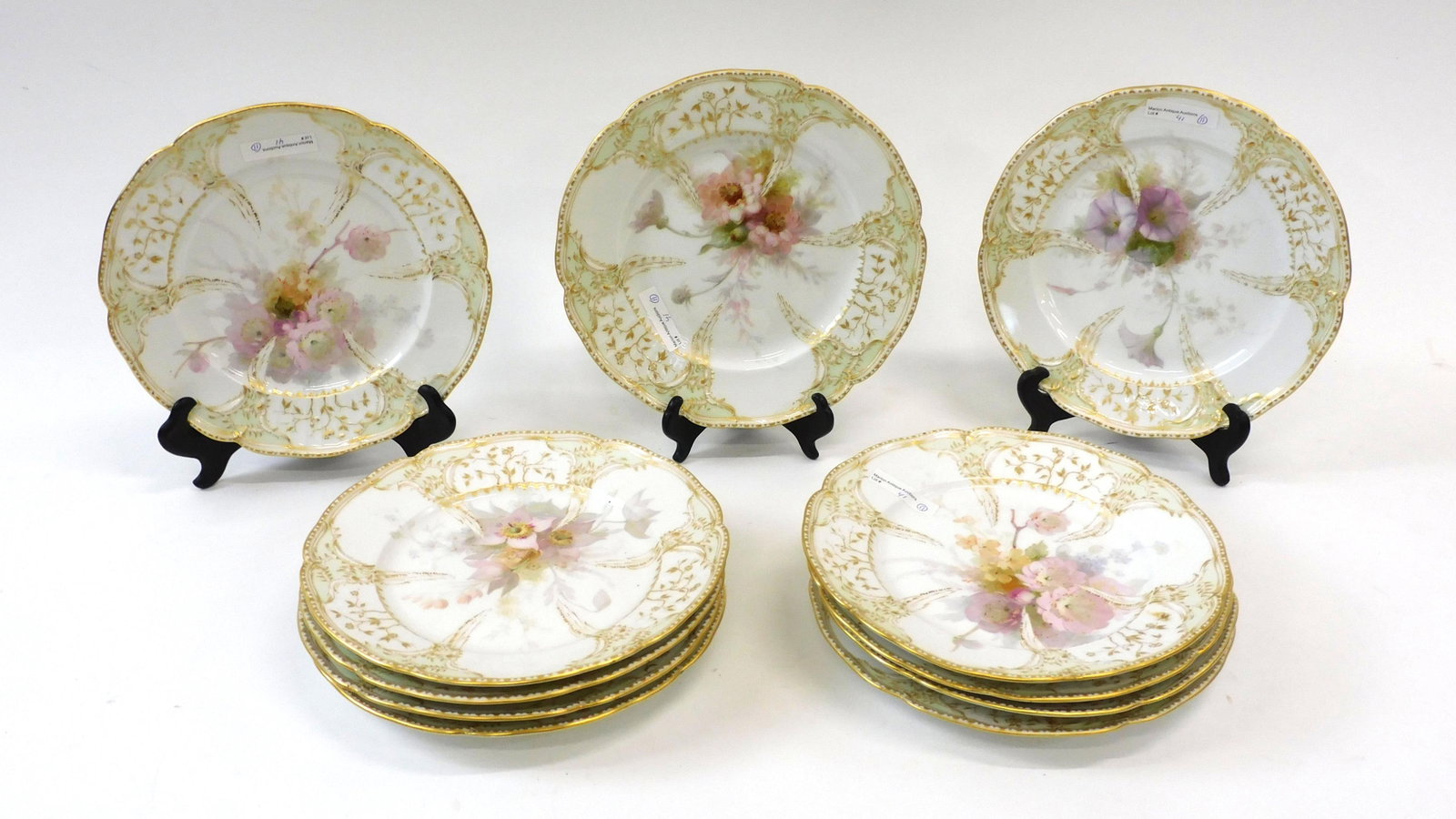 (11) KPM Porcelain Plates.: Late 19th century. Floral design with gilt embossed floral borders. Scepter and KPM mark, 9 1/4" dia. Good overall condition.