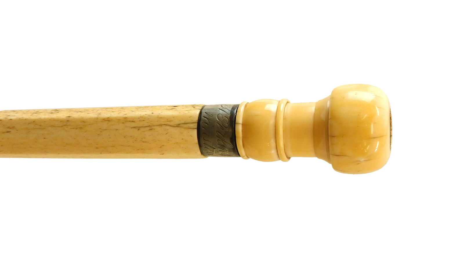 Scrimshaw Walking Stick: 1844, silver inset medallion dated 1844 on whale tooth pommel; silver collar marked "H. Perkins, Winsted". Turned whale skeletal bone shaft and bone tip. 34-1/2"L. Good overall condition.