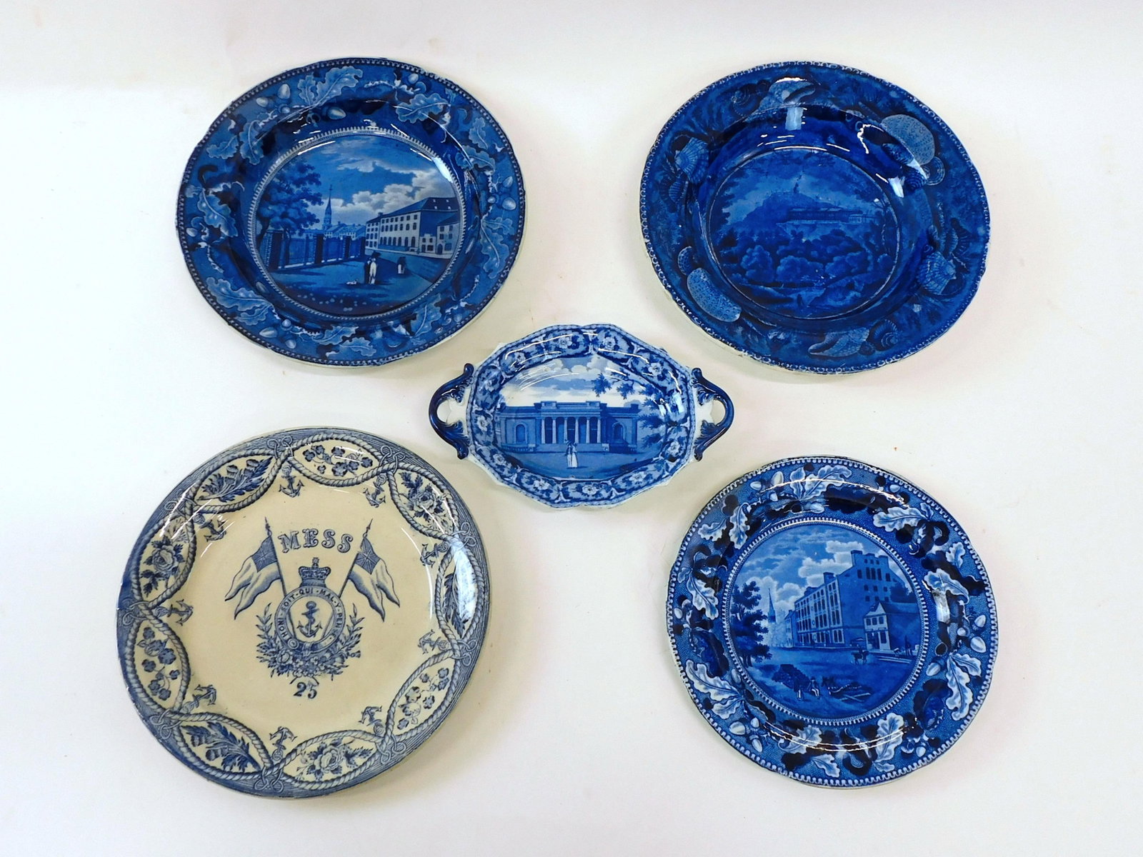 (5) Historical Blue And White Plates: 19th c, to include a rare British Royal Navy Mess plate #25, Queen Victoria era, rare with thistle, shamrock and English rose border, also cross, flags and anchor, 9 1/2" diameter. Shows crazing to ba