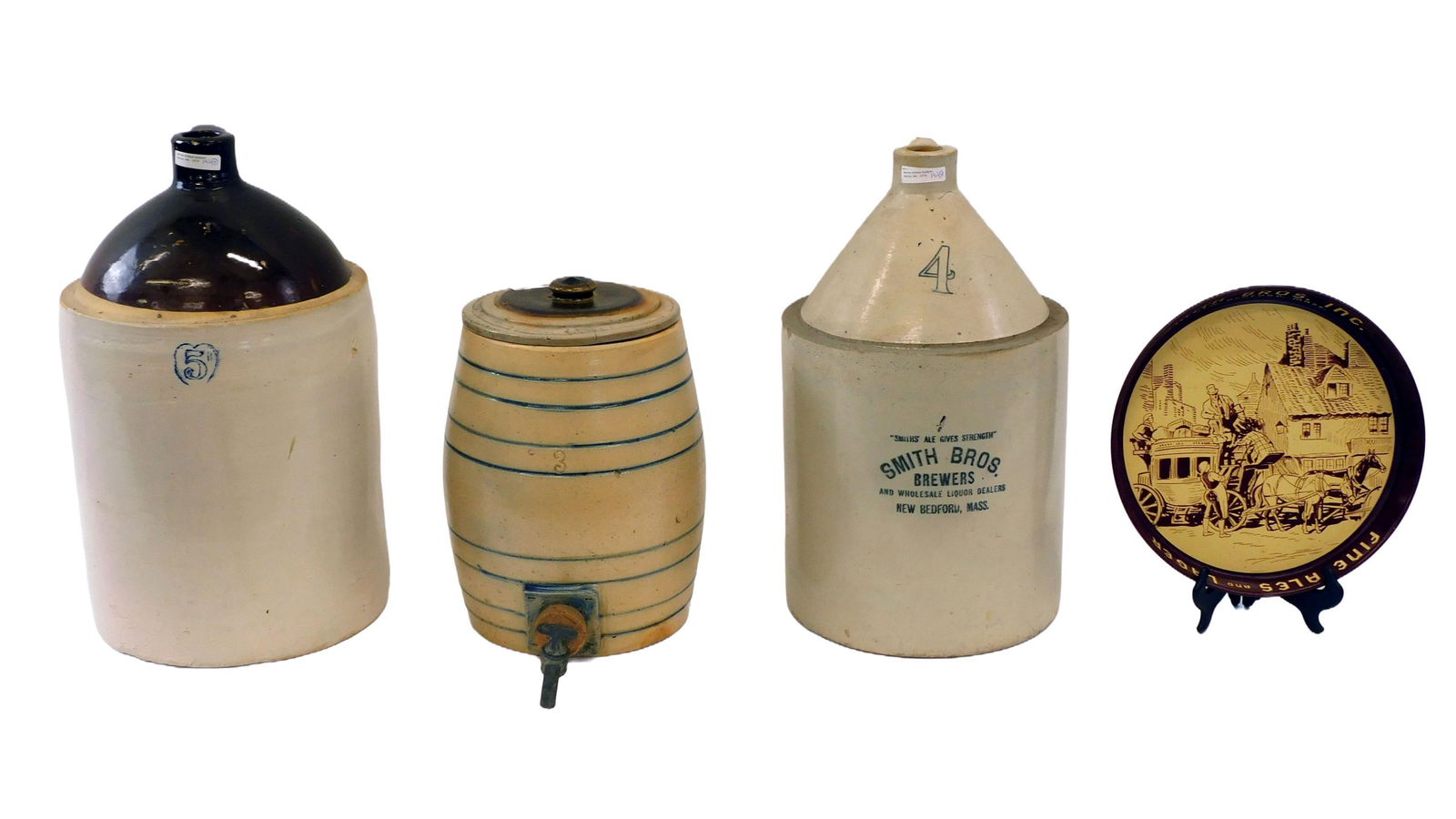 Stoneware And Tray Lot: 4 gallon Smiths Brothers' Brewers New Bedford, Mass. 18" high. Together with Smith Brothers' Fine Ale and Larder Tray. 12" diameter. 5-gallon brown and white jug with heart shaped shield, 19" high. A