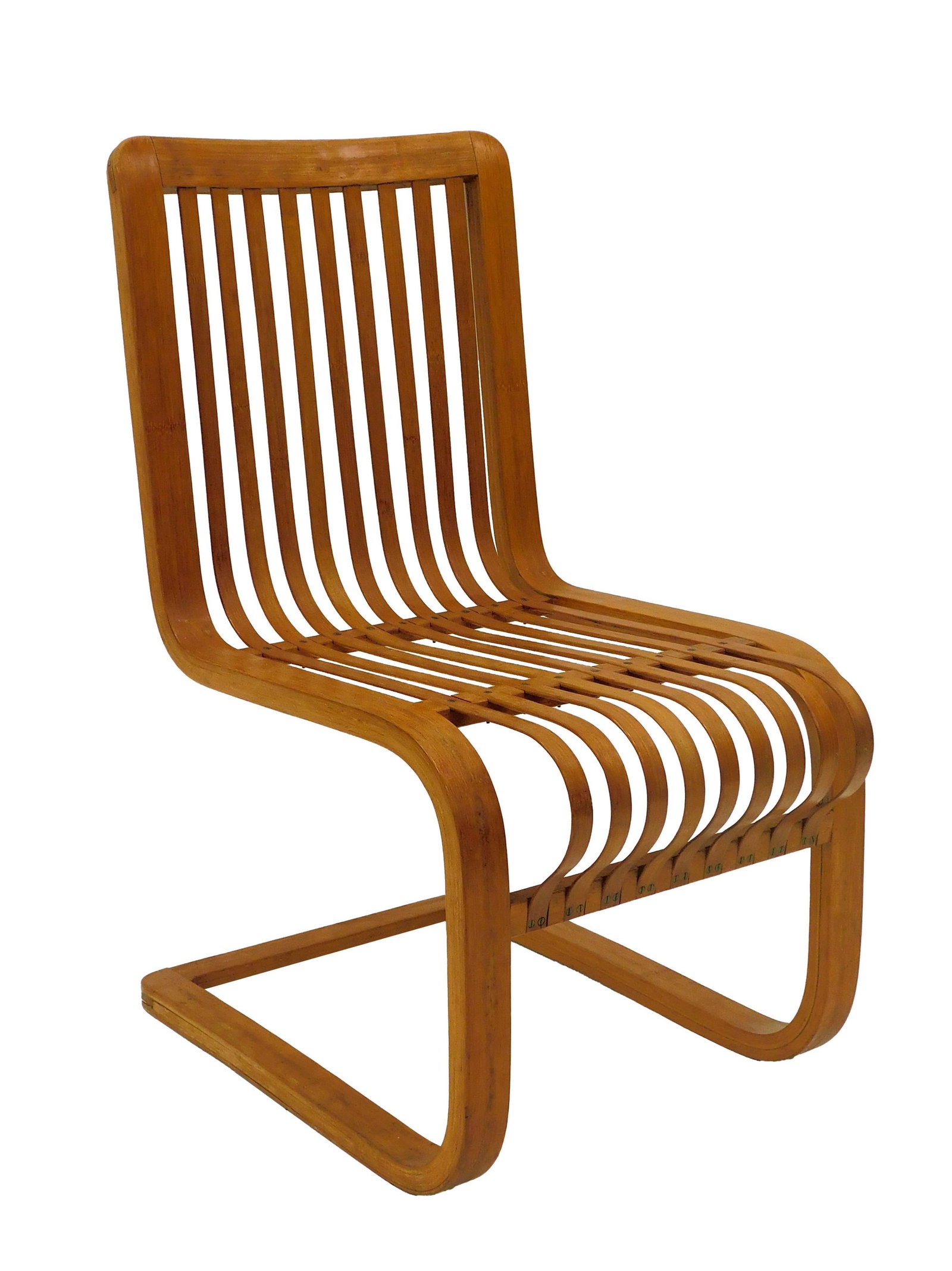 Ubanji Kidikoro Lounge Chair: 1930s. A cantilevered bamboo and brass lounge chair. 32 1/2" h x 17" w x 25" d. Good overall condition. One brass screw is missing. From the collection of Doris Lockhart Saatchi.