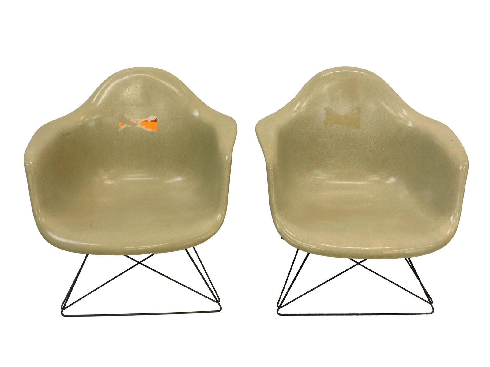 Pair Of Eames For Herman Miller LAR Chairs: Dated 1959. Charles and Ray Eames designed chairs designed for Herman Miller. Parchment molded fiberglass. Original labels. 24" h x 24-3/4" w x 23-1/2" d. Some surface abrasions, traces of old labels.