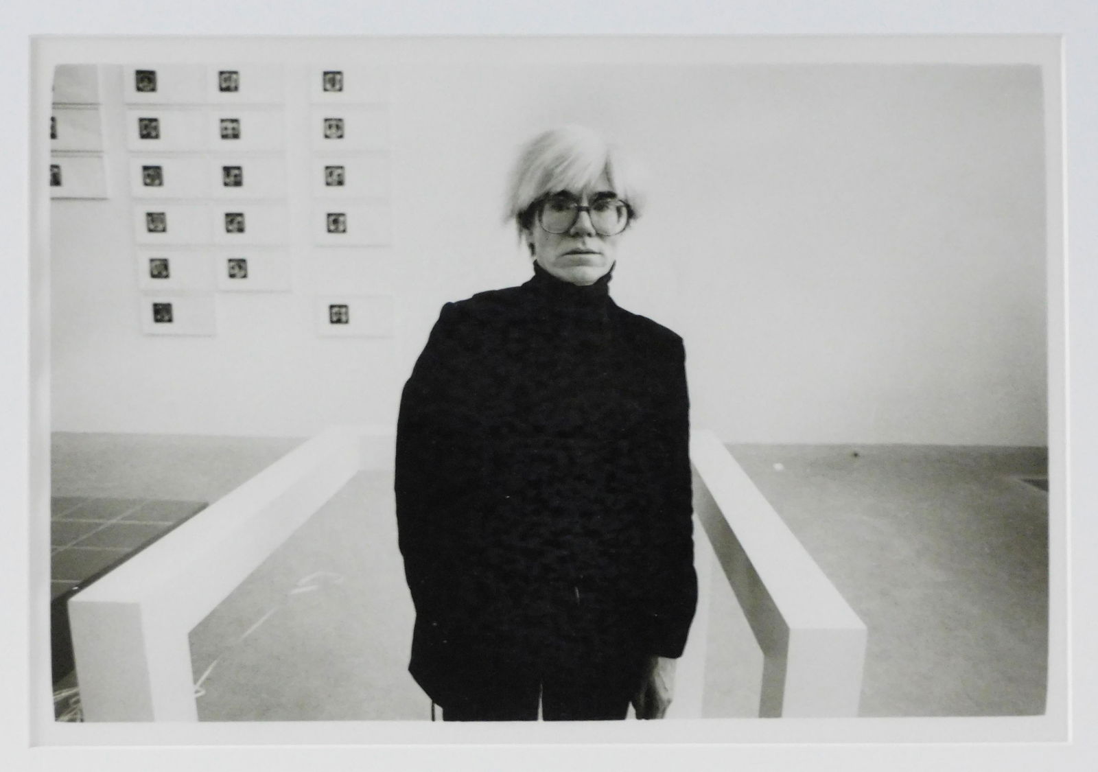 Christopher Makos: Andy Warhol Print: Dated 1986. Warhol at the Saatchi collection. Sight size: 12-1/2" x 18"; Overall: 19-3/4" x 25". Framed under glass. Provenance: Alexander Roussos Gallery, London. From the collection of Doris Lockhar