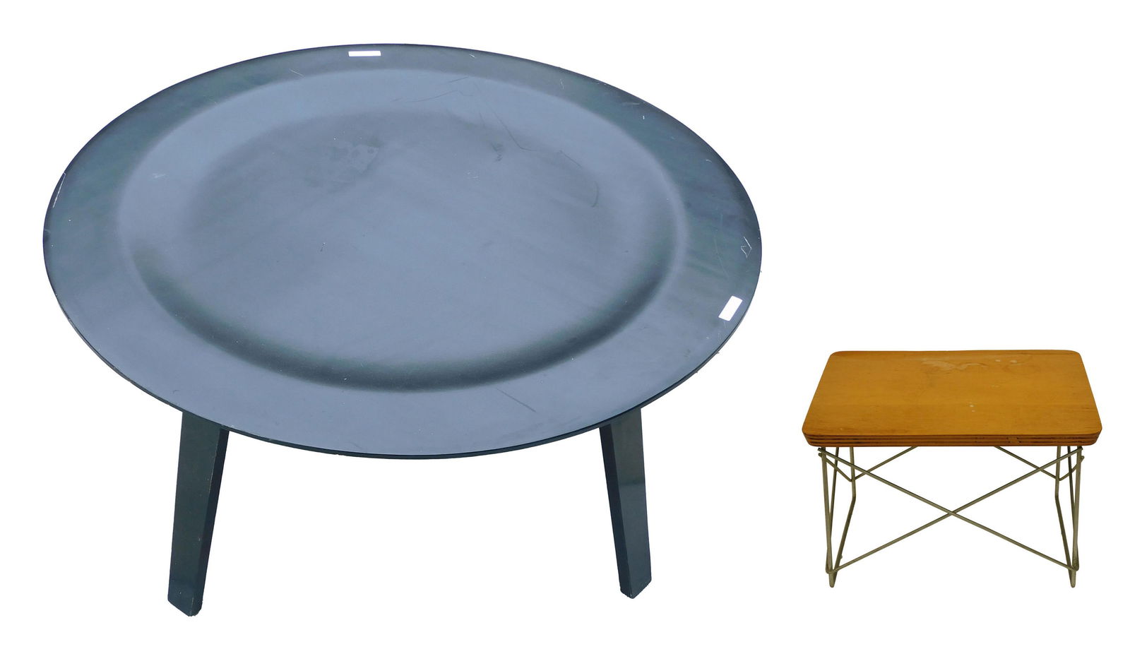 (2) Eames Tables: Mid-20th c. A) Miniature Charles & Ray Eames for Herman Miller LTR table, original label on underside. Laminated plywood, zinc wire base. 10" h x 15-1/2" w x 13-1/4" d. Top shows some fading and stain