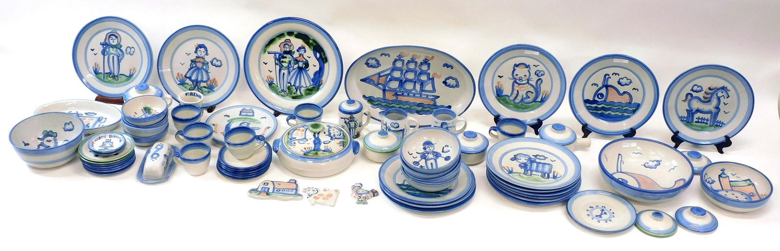 (65) Pieces M.A. Hadley Pottery: to include (4)whale plates 11" d., Spaghetti bowl with whale 11", (10) various animal plates 11", a 13" plate with farmers, 11" oval platter with cow, 8 1/4" bowl with chicken. (4) bowls with skier 6