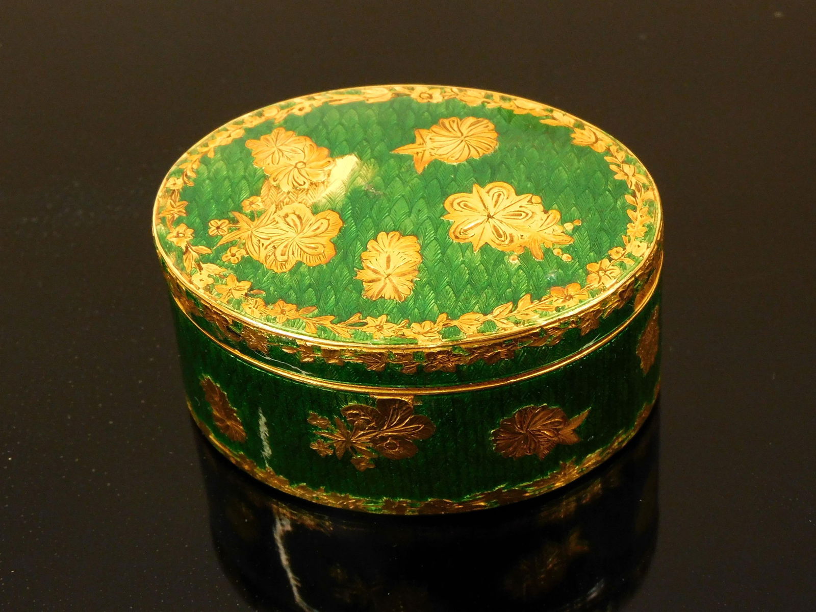 14K Gold Enameled Box.: French. Floral and leaf design. Enamel shows some loss. 41.2 dwt. 1 1/8" high, 2 1/8" wide x 1 5/8" deep. Hallmarked. Please note: this must be paid for by wire transfer, known check, or cash. Items w