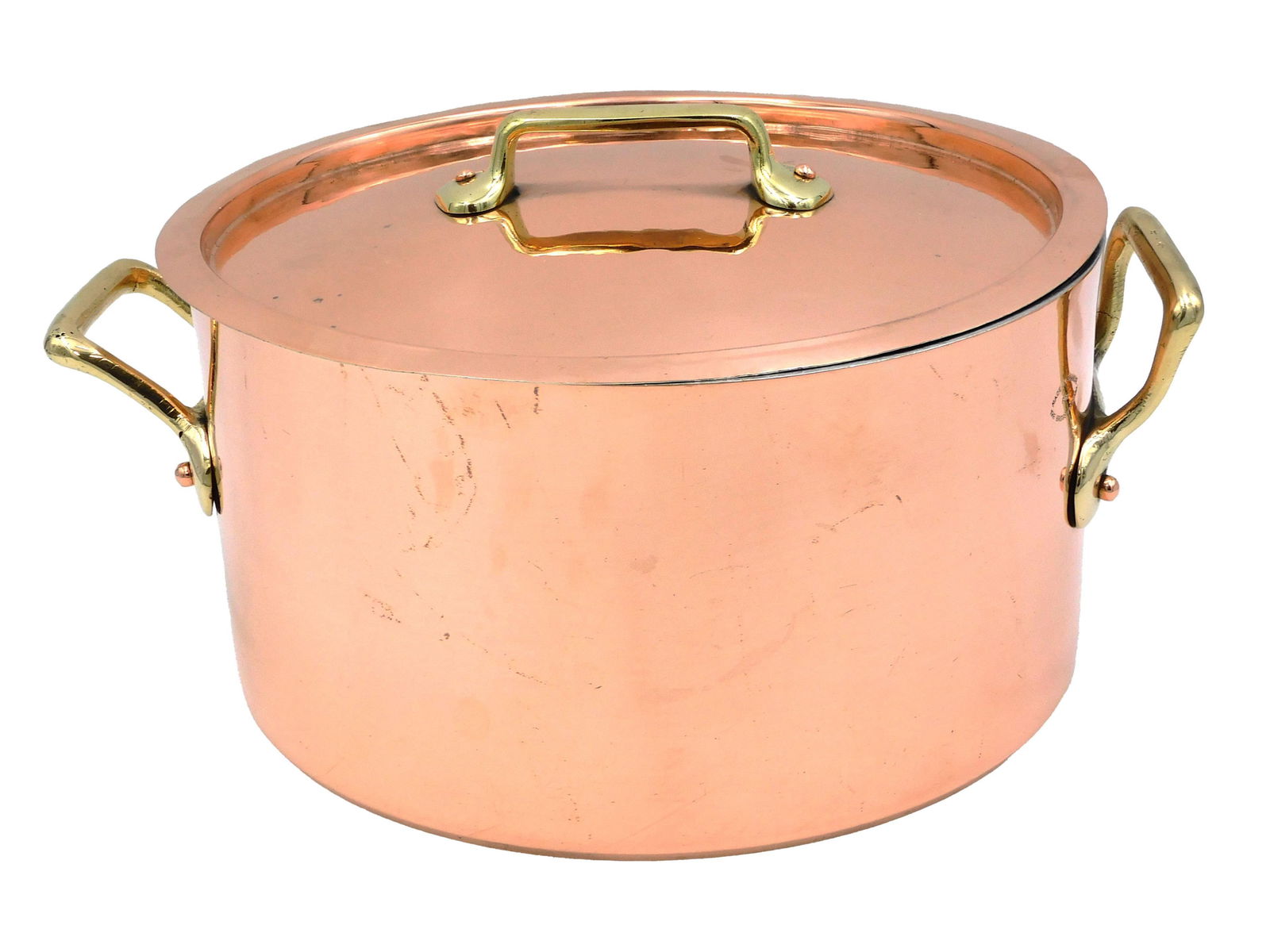 Vintage French Copper Stew Pan.: Brass handles. Hand hammered lid. The pot is marked Made in France for the Bridge Company. Recently professionally retinned in USA. 5 3/4" high without lid. 10 3/4" diameter. With handles 13" wide. We