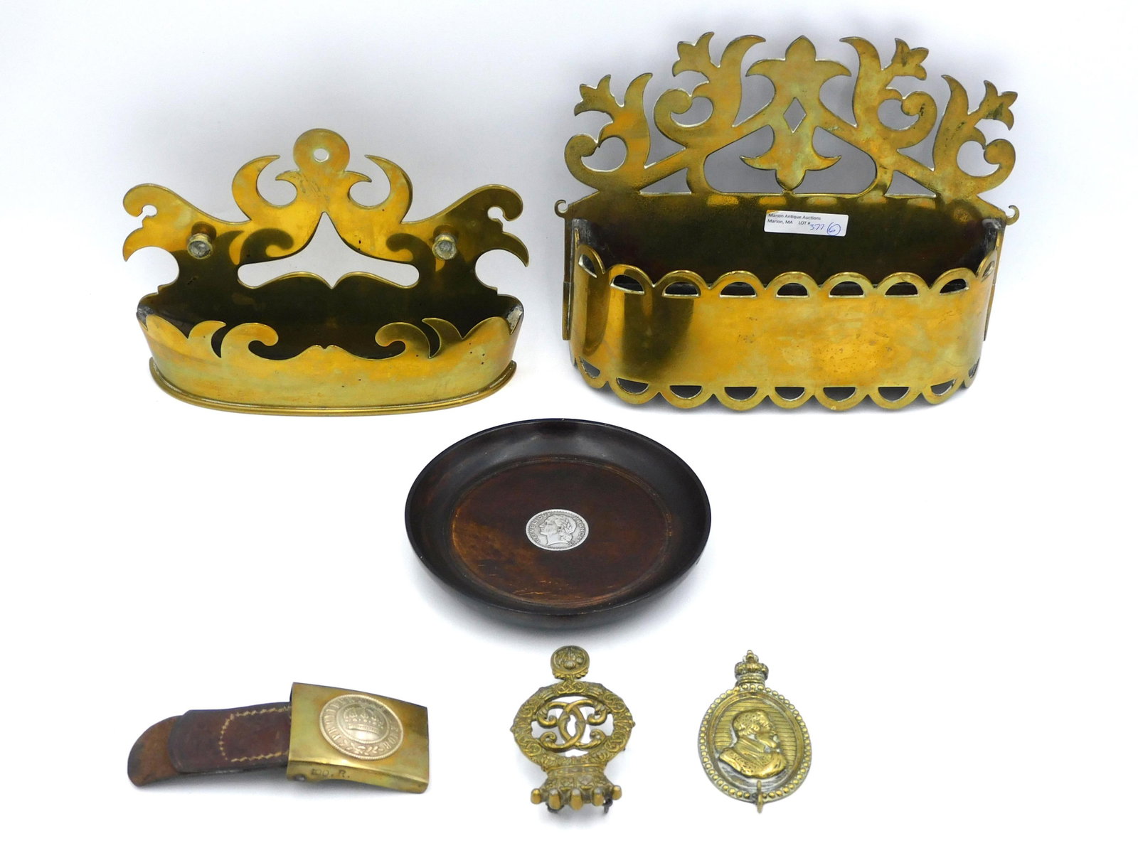 (6) Piece Antique Metal Lot: to include two early brass wall boxes 6" high x 8 1/4" wide and 7 1/2" high x 9 3/4" wide. Lignum Vitae tray with inset French silver coin 5 7/8" diameter. WWI German brass buckle with partial strap 2