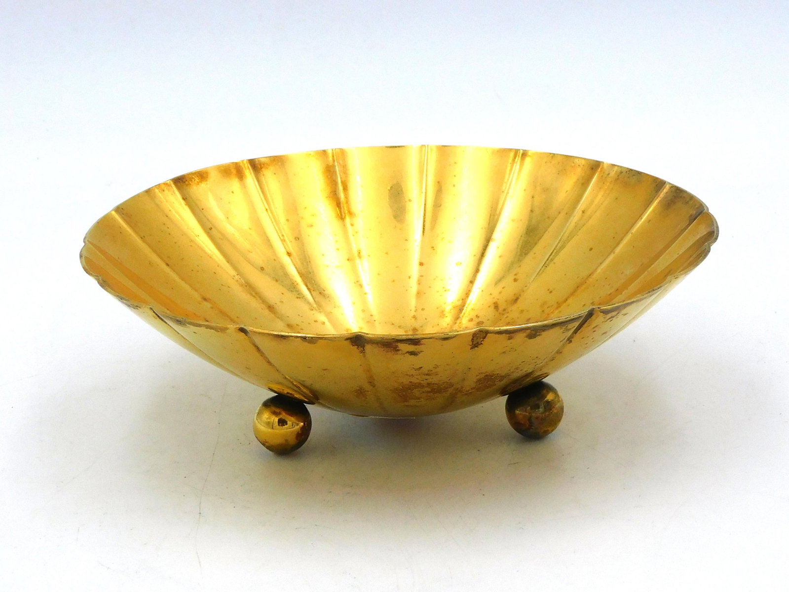 Tiffany Sterling Silver Footed Bowl: 20th century. Gilt surface. Incised line design. Marked on base "Tiffany & Co. Sterling Silver" and numbered 22673. 1 3/4" high x 6" diameter. 7.20 ozt. Provenance: From the estate of Alan Gaines of A