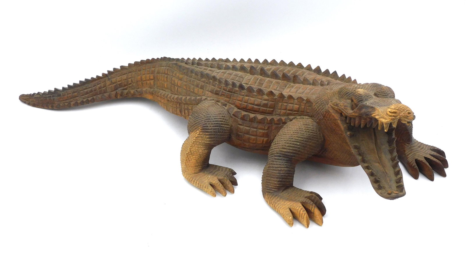 Carved Wooden Alligator: Probably late 19th century. Exceptional detailed carving. 23" long x 7" high x 10" wide. Overall good condition. Provenance: From the estate of Alan Gaines of A & A Gaines Antiques, Newport, Rhode Isl