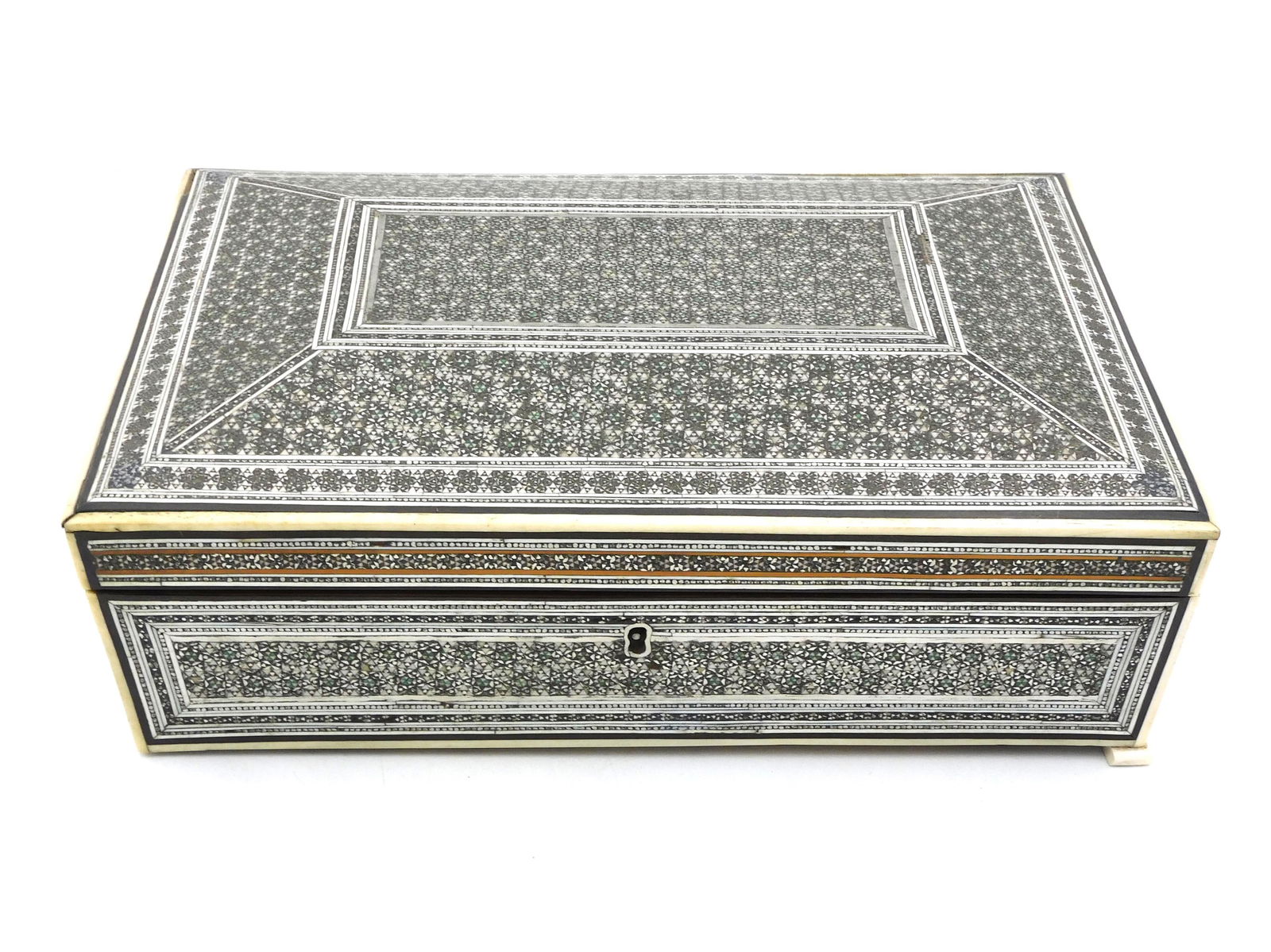 Anglo-Indian Traveling Sewing Box: 19th century. Wood with micromosaic and bone inlay. Rectangular shape, dome lidded top. Opens to reveal a removable mirror with inlaid trim, compartmentalized interior with inlaid bone needle cases, t