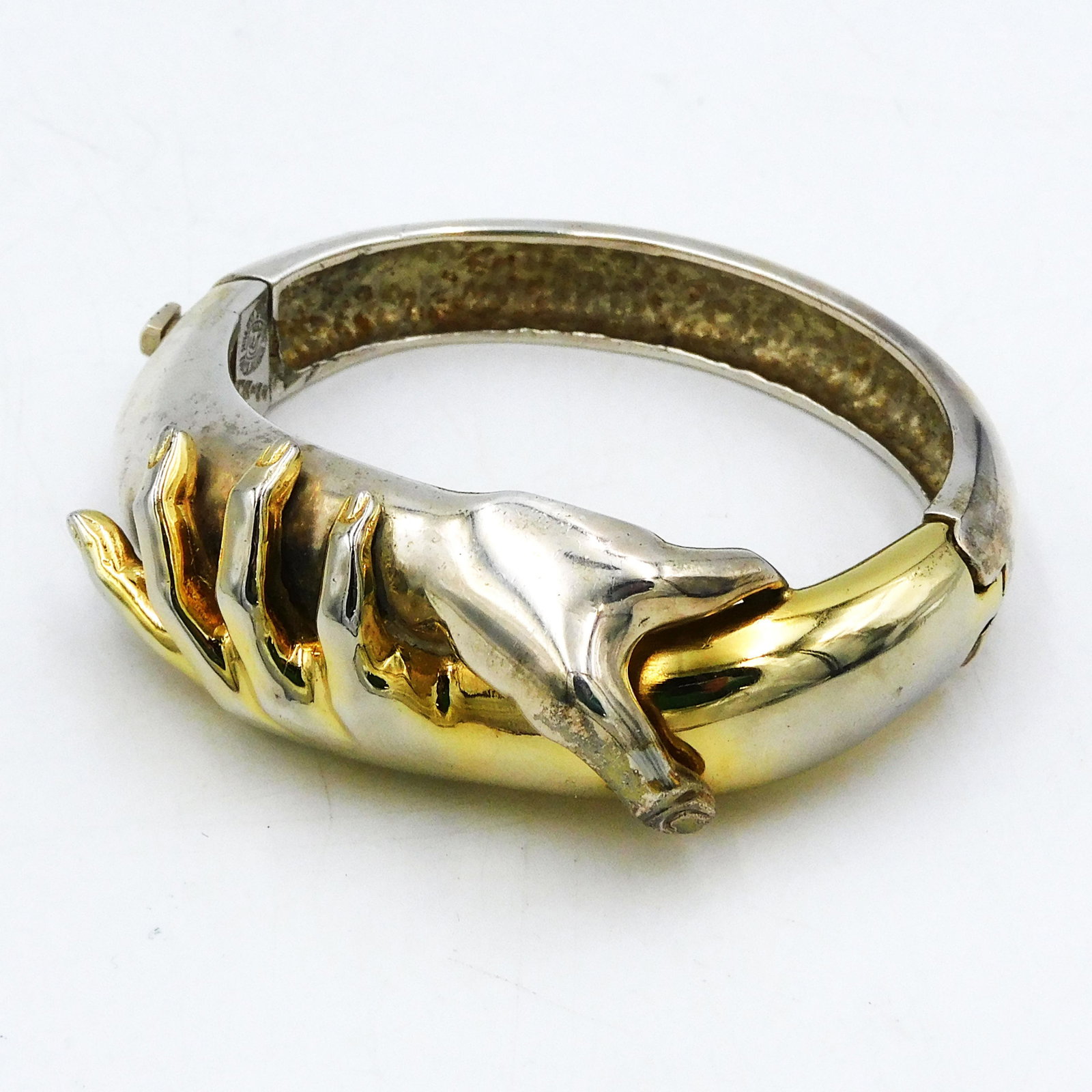 William Spratling Clasped Hands Cuff Bracelet: William Spratling (American, Mexican). Ca. 1964-1967. Sterling silver with gold-plated finish. Hinged. Script square mark with .925. Interior 2 1/8" wide. 2.35 ozt. Gold wash faded. Shipping Restricti