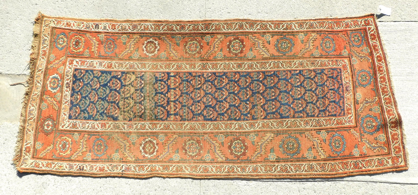 Antique Caucasian Rug: Early 20th century. Geometric floral design with gulls in the central panel. 85" long x 33 1/2" wide. Shows overall even wear. Slightly crooked.