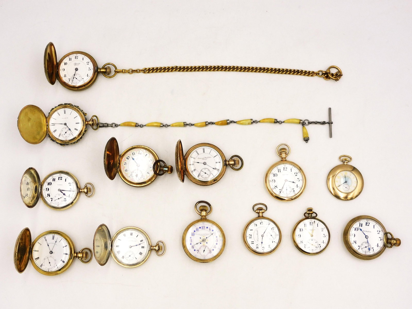 (13) Gold Filled Watches: To include: A) (7) Hunter cases. Two with hunting scenes, two engraved locomotives, one engraved steamship and bull, one with eagle, one with bear and deer design. Not working. B) (6) open-faced watch