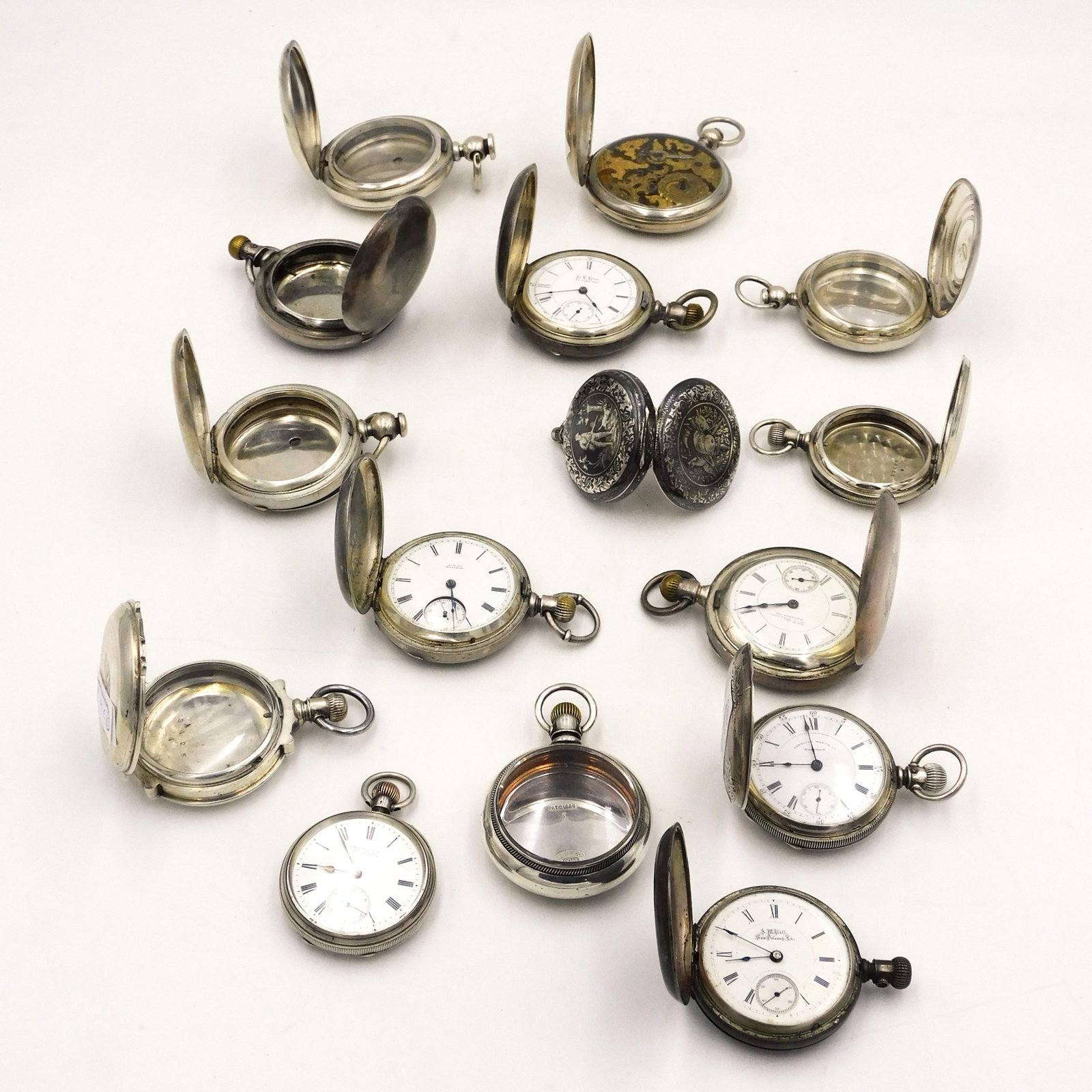 (15) Coin Silver Watches and Cases: To include: A) (6) Hunter case with watches. B) (1) open face. Ranging from 1 7/8" 2 1/2" diameter. C) (7) Hunter cases ranging from 1 7/8" - 2 1/4" dia. (D) (1) Open face case. 26.63 ozt. case weight