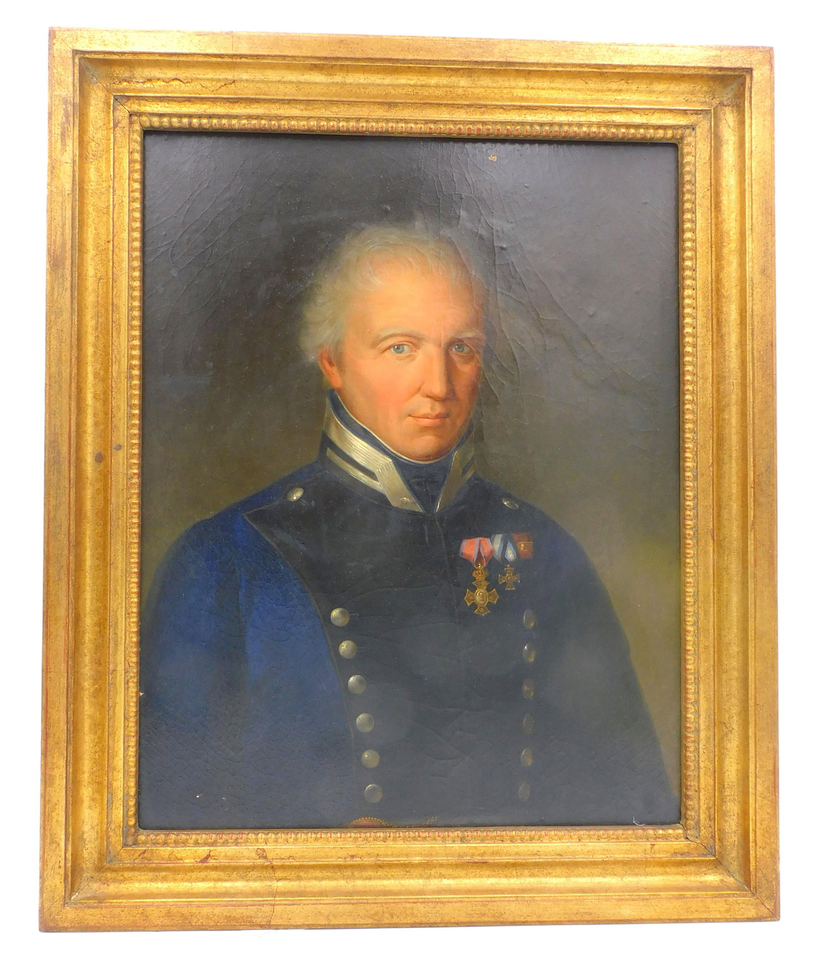 Portrait of a Military Officer: 19th century. Oil on board. Depicts a military gentleman in uniform with medals. 16" high x 12" wide. In a gilded frame measuring 20" high x 16 1/4" wide. Tiny bit of paint loss on upper-middle border